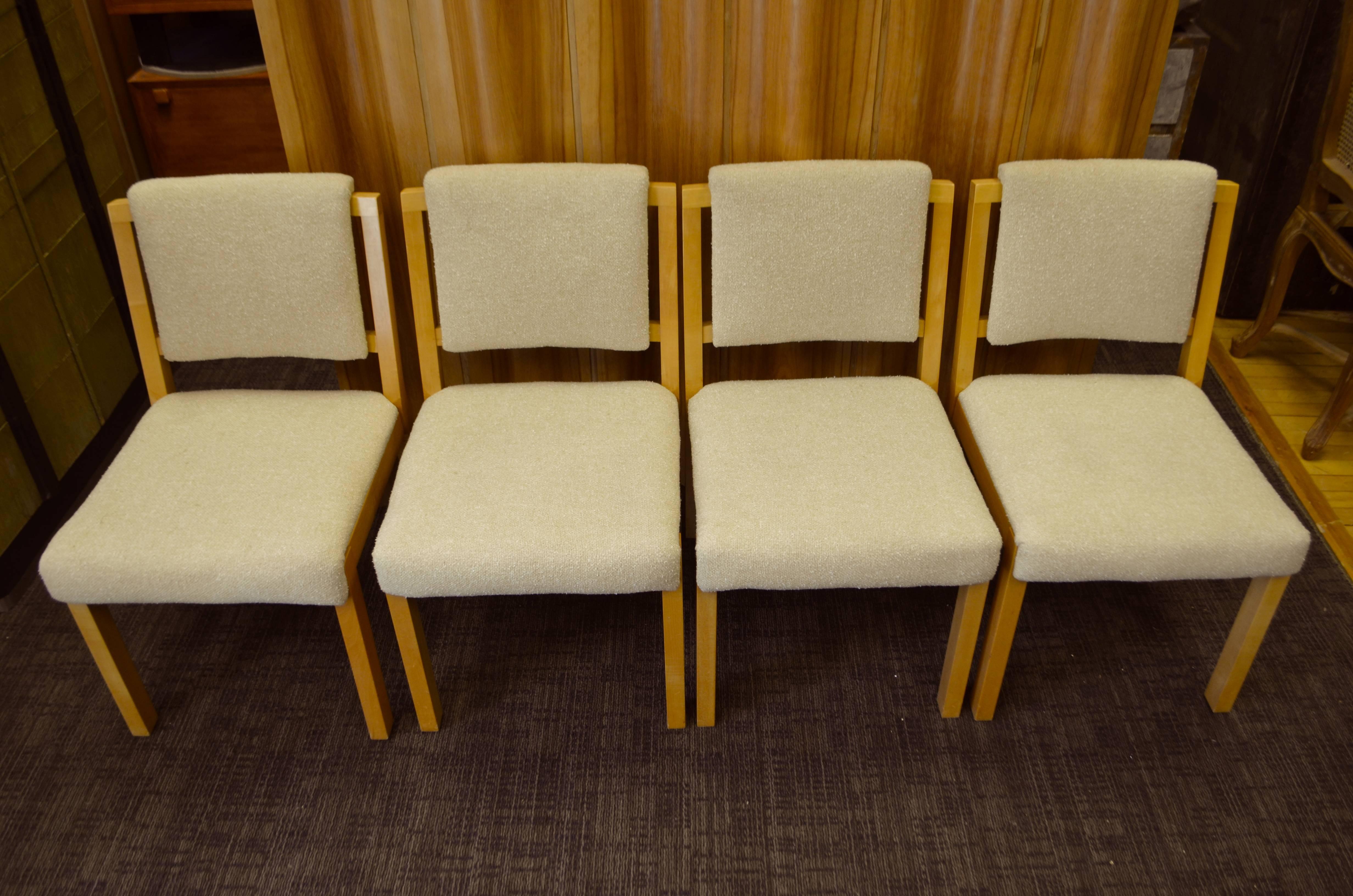 Midcentury dining chairs, set of four, with rock solid maple frames and seats beautifully upholstered in wool. Handsome seating in Classic midcentury profile. Crafted to perfection. Comfortable sitting. Gratifying to behold. Color of upholstery is a