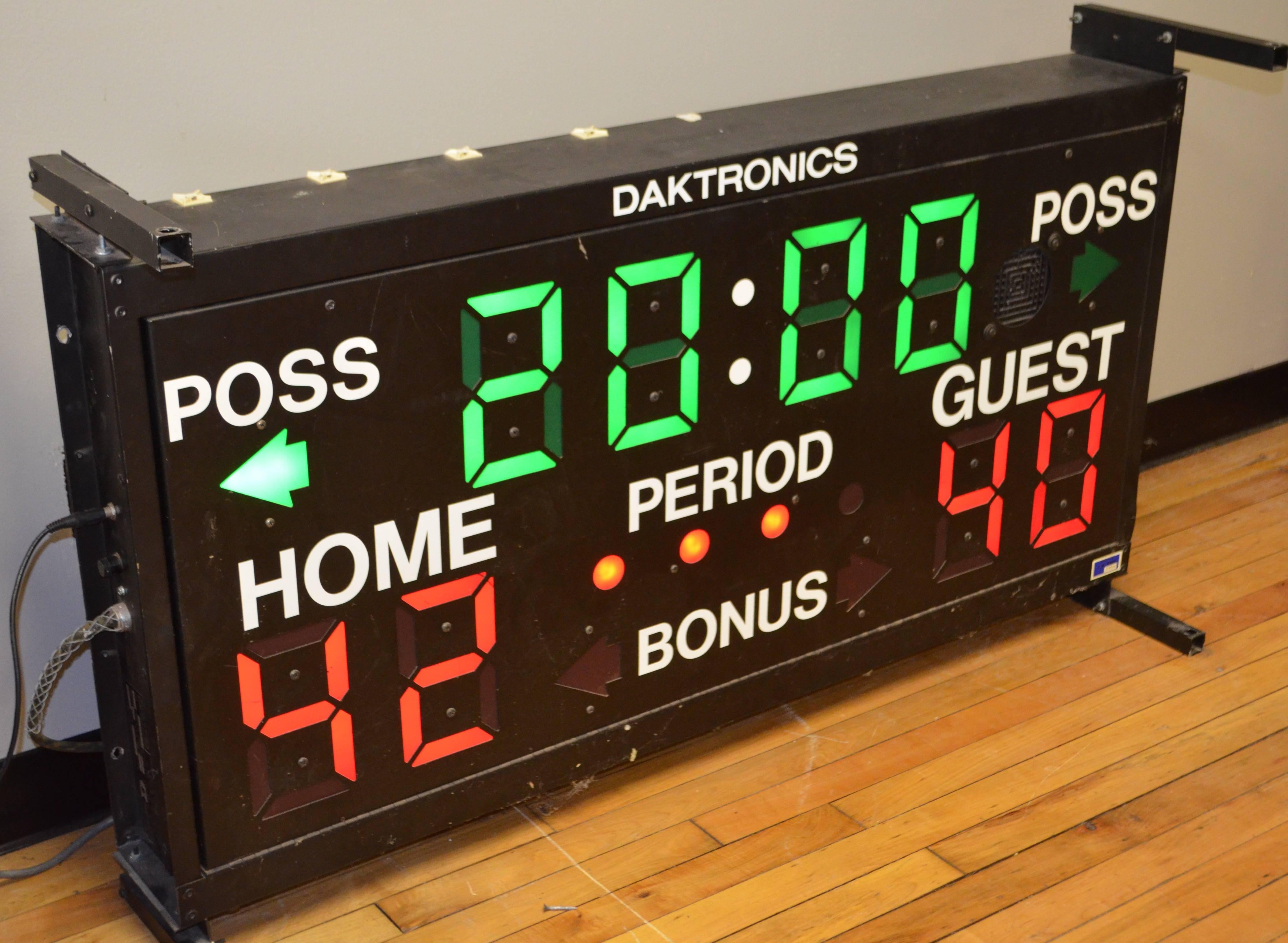 High school basketball scoreboard is neat, clean, fully operational and lightweight with all wiring included as well as control panel. Scoring numbers are much more vibrant red than the camera could depict as is the green of the time. Metal screen