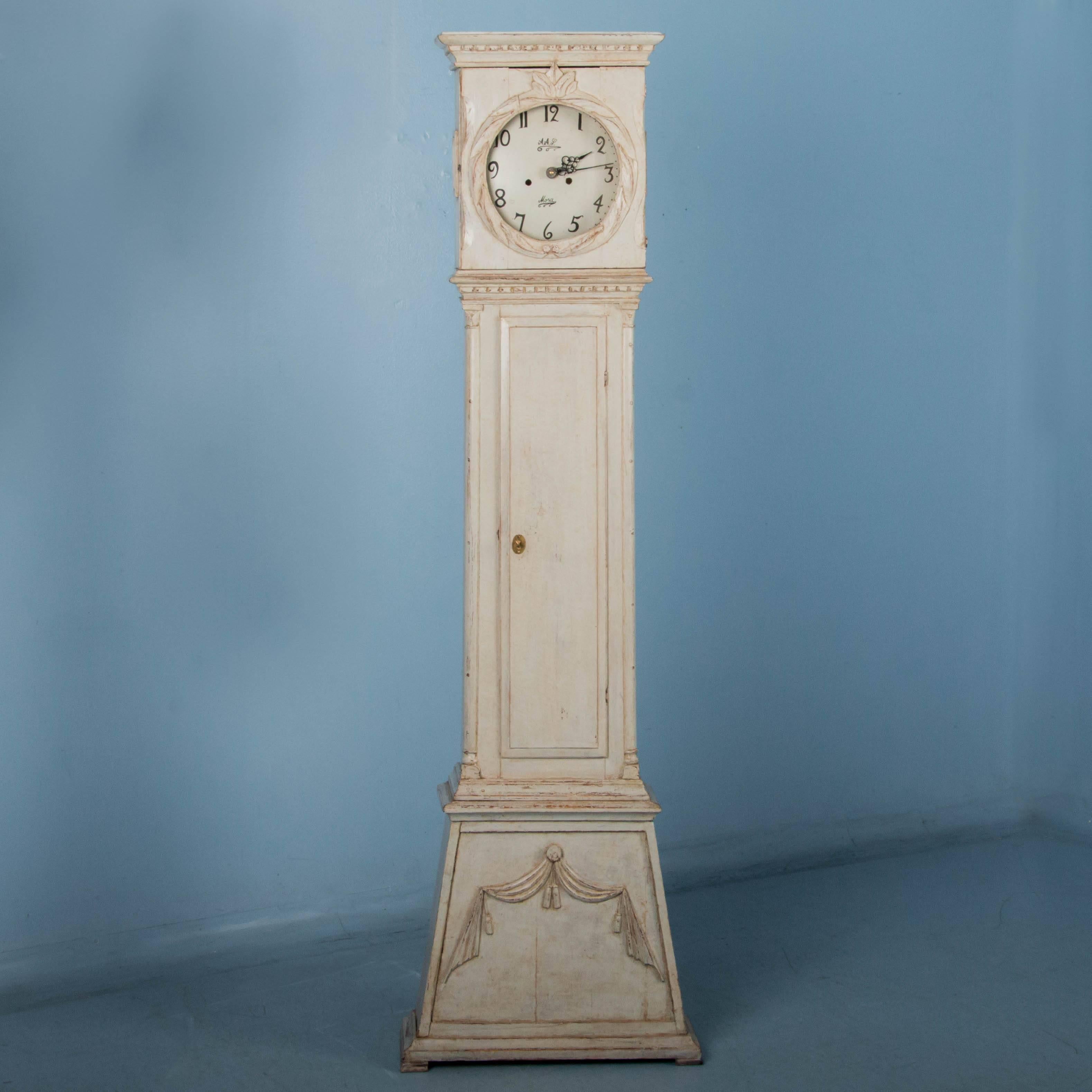 Handcrafted in the traditional mid-19th century Danish style, this charming grandfather clock is unusual due to it's smaller scale. The exceptional original grey paint is lightly distressed creating the perfect contrast with the dark pine underneath