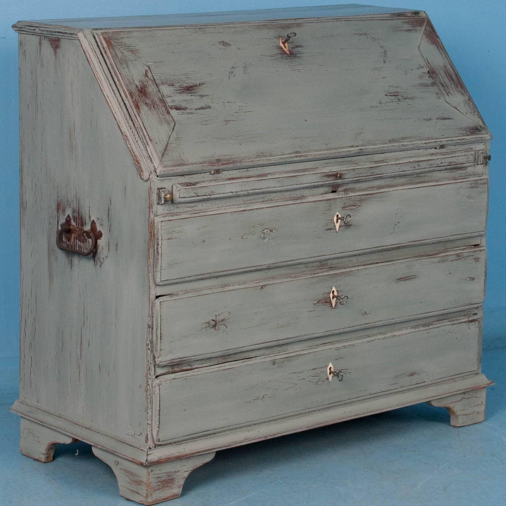 One can imagine this secretary or drop front desk gracing a European lady's country home in the 1840s. Gray was popular in the Gustavian Style, so this desk was given a dove gray chalk paint finish to compliment its Swedish roots. In the photos, see
