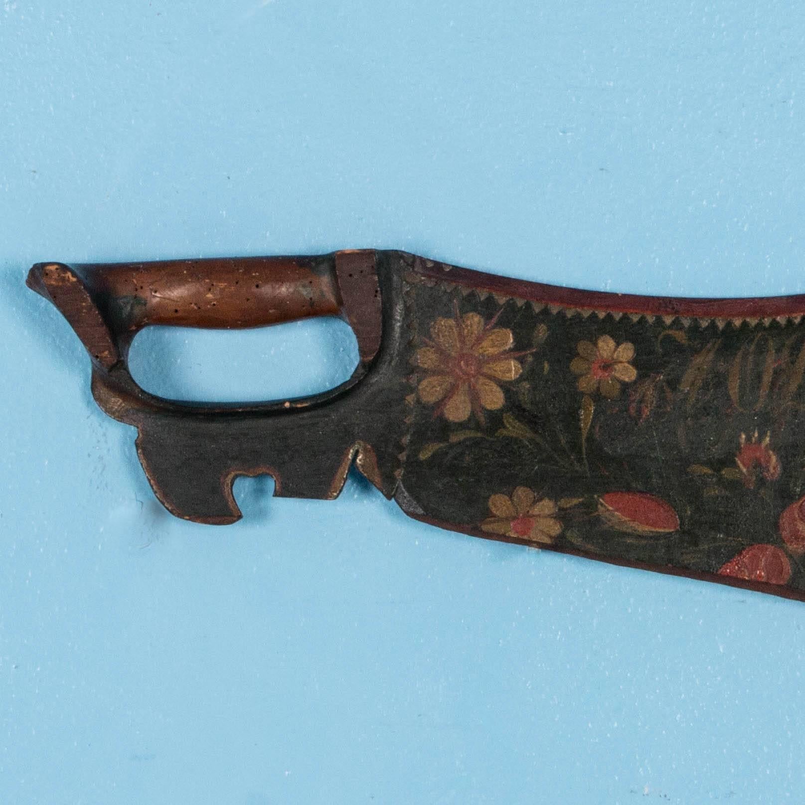 This hand-carved skaktetra was traditionally given away as a bridal gift, usually with beautiful painted decorations and often dated. This one has the bride's initials and is dated 1849 with red and yellow flowers on a dark blue / black background.