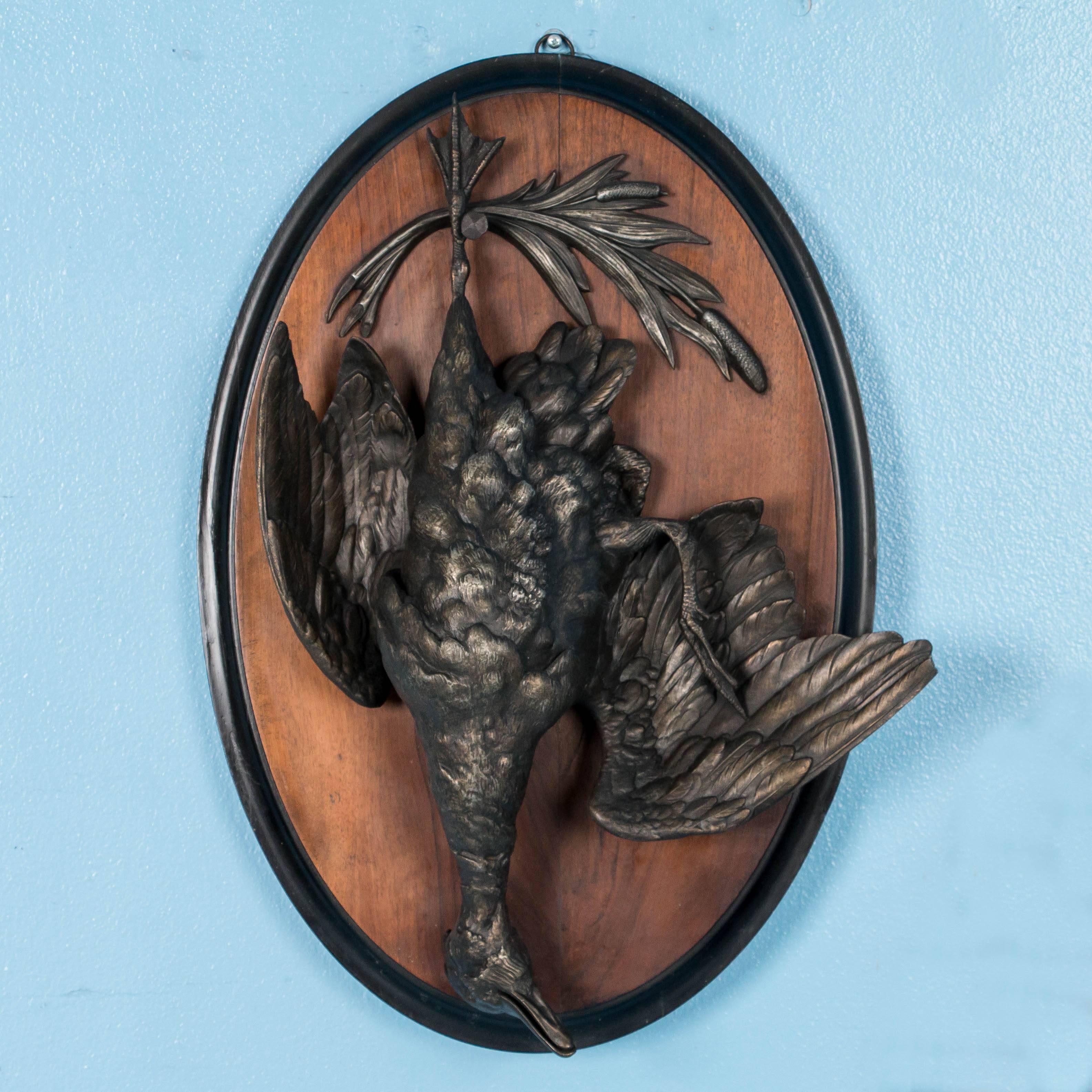 The amazing attention to detail is what first grabs your attention along with the large-scale of these two game birds, one a pheasant and the other a duck. The metal is a bronze patinated pot metal which is slightly worn highlighting the feathers of