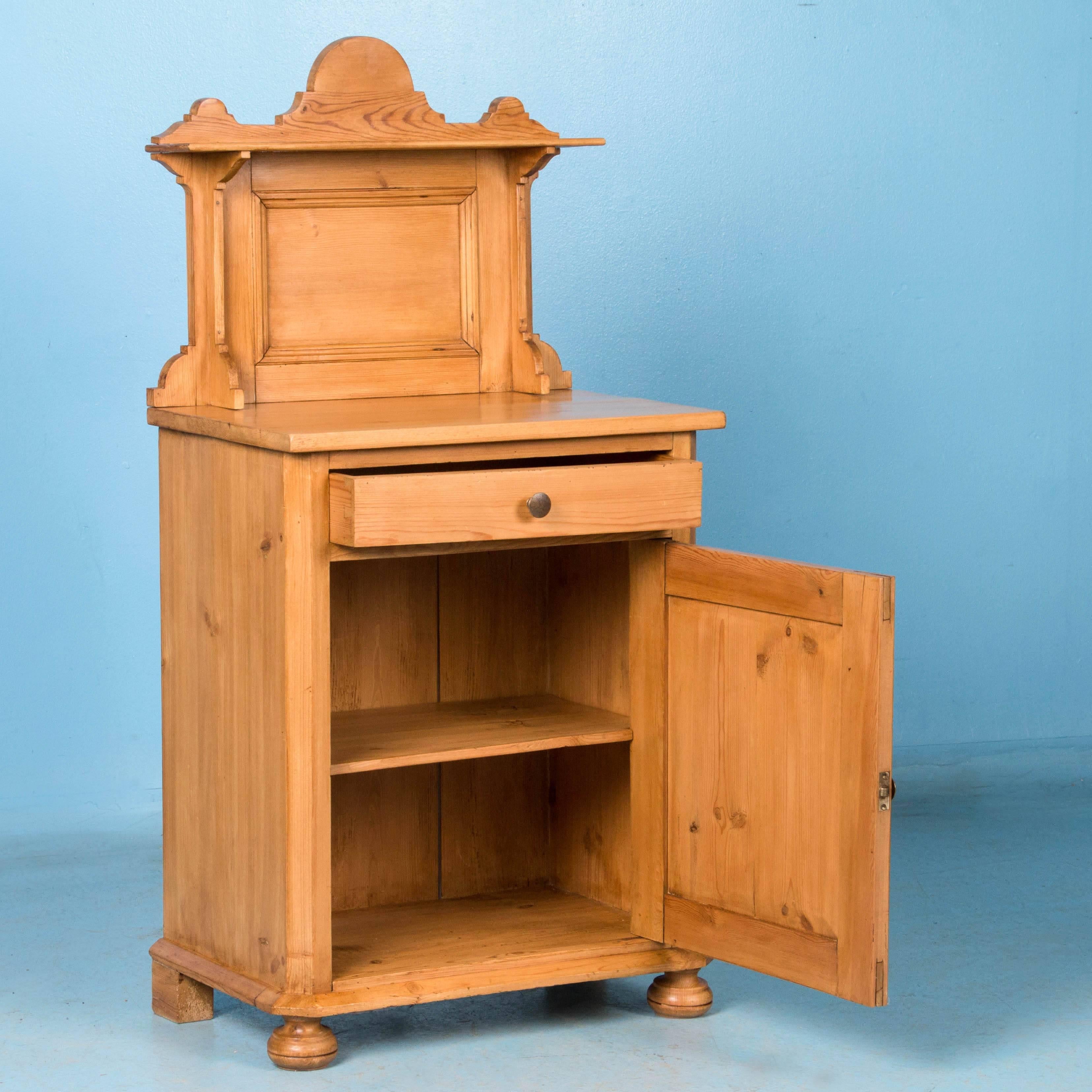 Simple and elegant describe this traditional country nightstand in natural pine with a soft wax finish. The tall paneled and molded back splash adds an architectural appeal and of course extra height, but can easily be removed if necessary. The case
