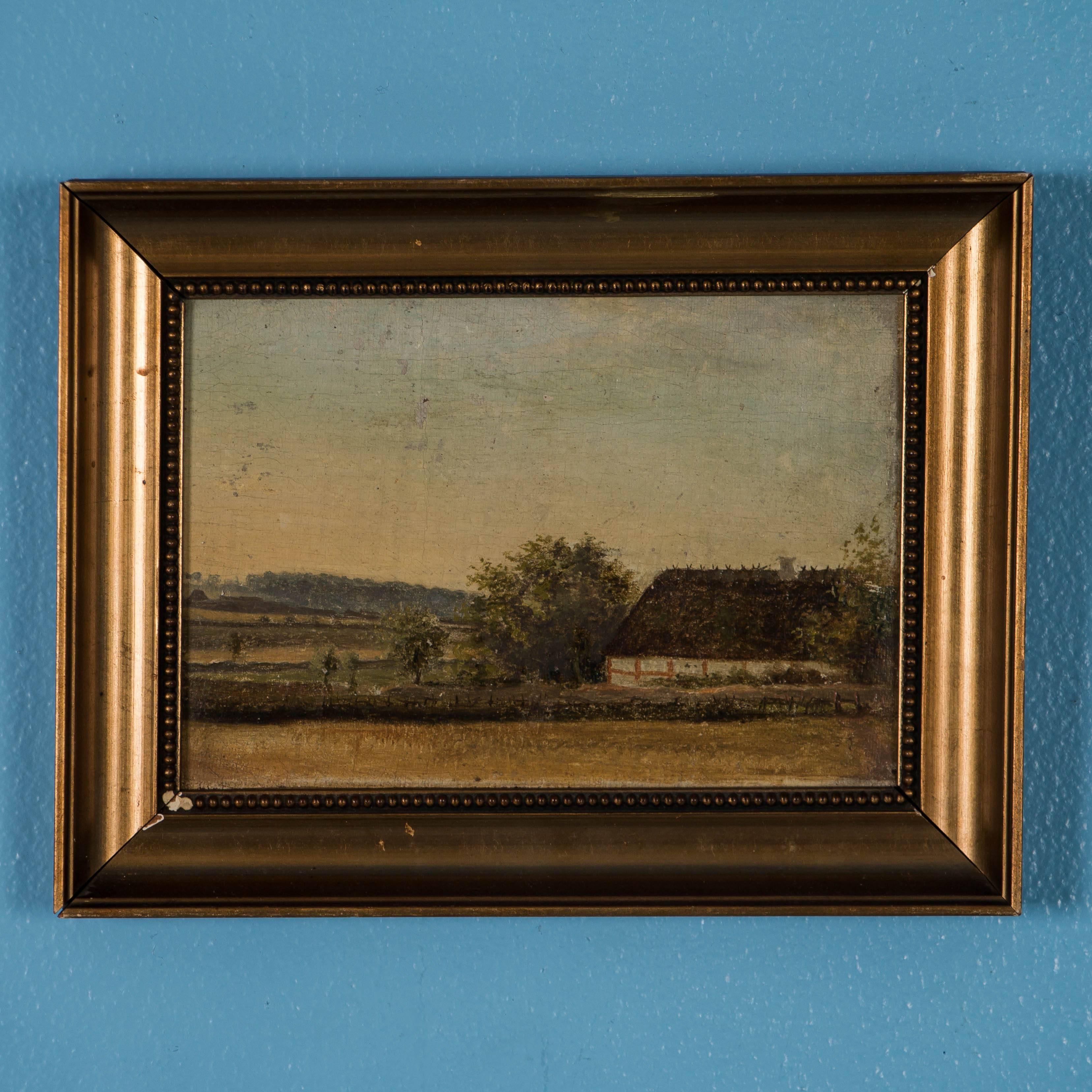 Pair of antique landscapes with very quaint Danish farmhouse with thatched roof  and a Danish windmill. Unsigned, both are oil on canvas laid on board and contain age related craquelure with minor paint losses that do not detract from gentle appeal