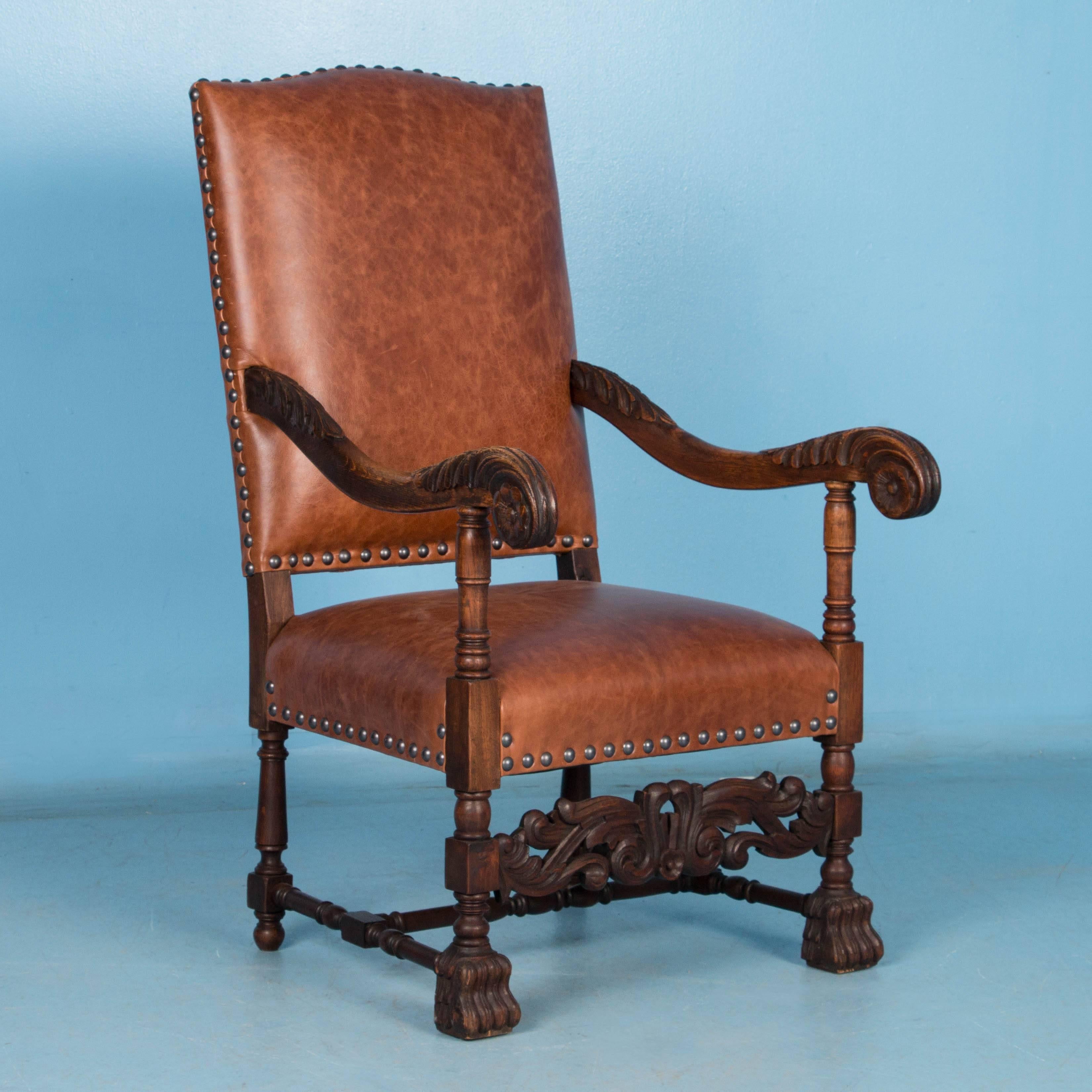 This pair of arm chairs are an exceptional find for a variety of reasons. The hand carved oak baroque style of the late 1800's creates a stately appeal that is timeless, especially the perfect curve of the arms. Yet it is the addition of new