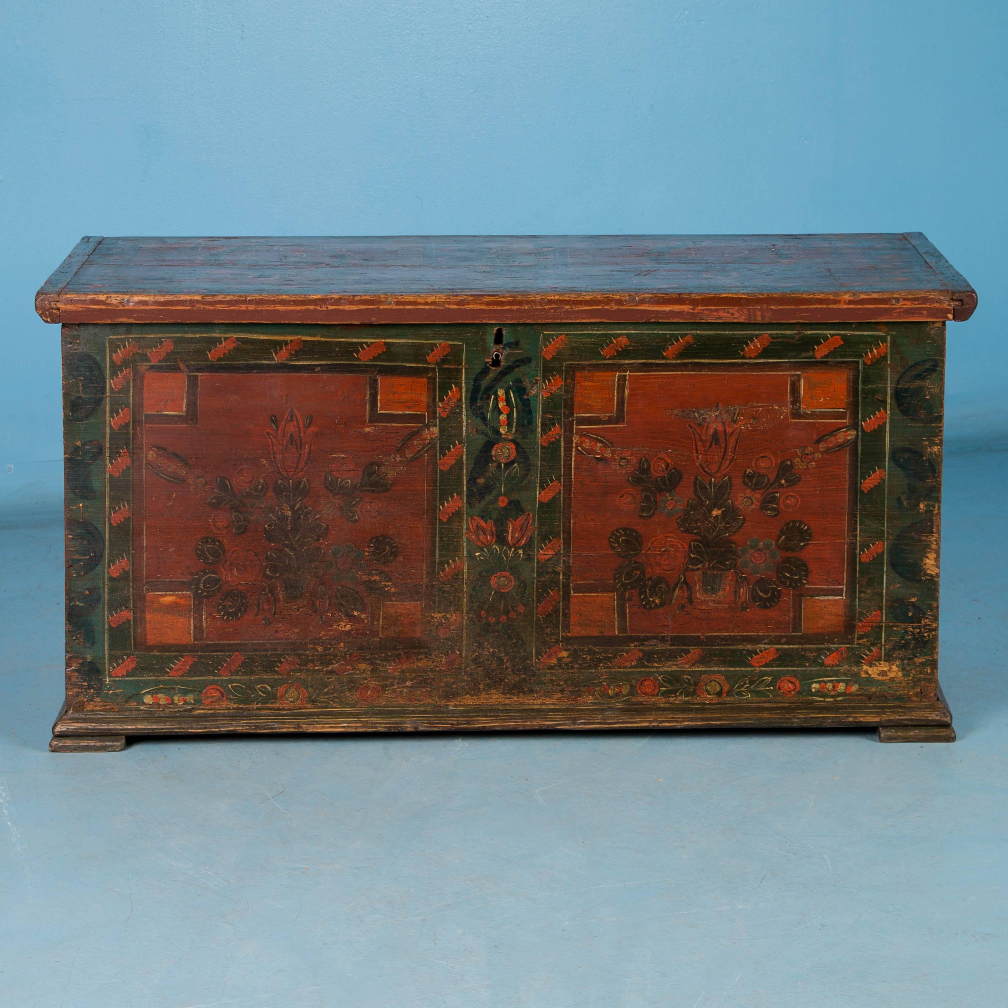 This original painted trunk with red and green floral details is a great example of Romanian folk art and is dated 1915. The flat top allows it to serve many functions in a modern home, including small coffee table, side table, blanket or toy chest.