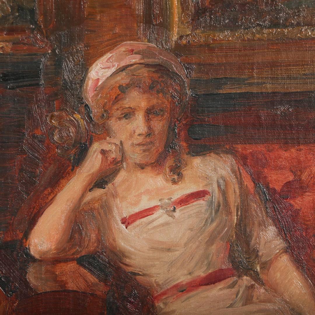 Lovely depiction of a young woman in flowing white dress sitting on a red couch. Double signed and dated Otto Bache 1911 and Otto. Oil on canvas laid on cardboard with gold frame. 11