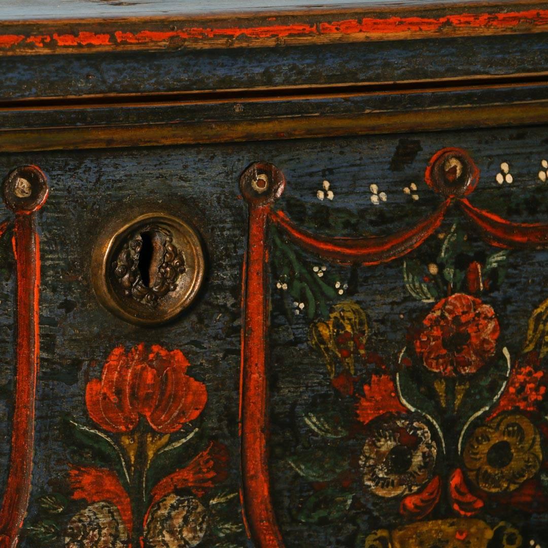 This remarkable blue painted trunk has beautiful red floral details on both the front and sides. The words “Antal Zuzanna. Roku 1883” are painted on the front. This piece has been professionally restored with a wax finish and it ready to be used and