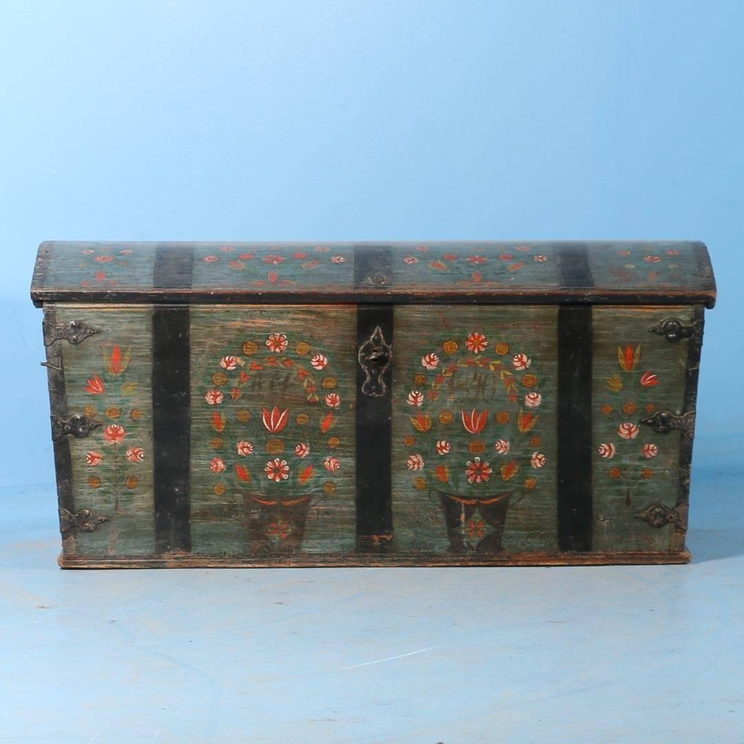Antique dome top trunk from Sweden dated 1840 with original blue/green paint, beautifully finished with a hand rubbed satin wax. There are two arrangements of red and white flowers and the date 1840 painted on the front of the box and along the top