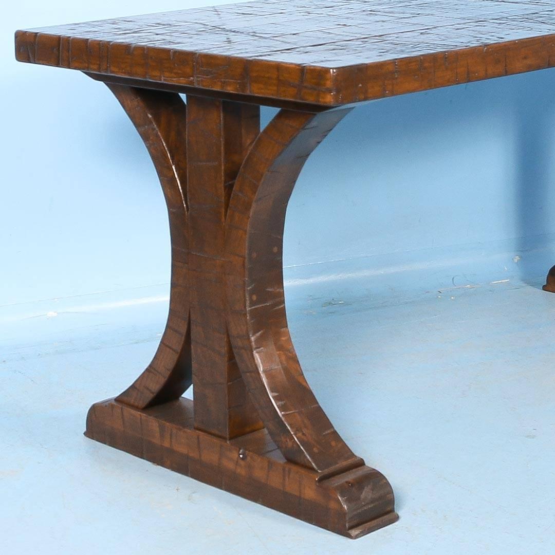 The strong visual impact of this table is due to the reclaimed wood top and architectural feel of the base. The top is made from reclaimed railroad cart or boxcar wood so it shows the wear and distress of constant years of use. The top is heavy and