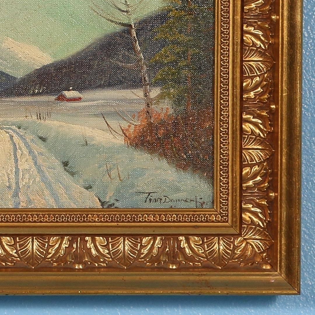 Signed oil on canvas of a winter landscape a mountain stream with a cabin in the distance in an ornate gold frame. Please enlarge and examine the close up photos to appreciate details in the painting.

Scandinavian antiques imports containers from