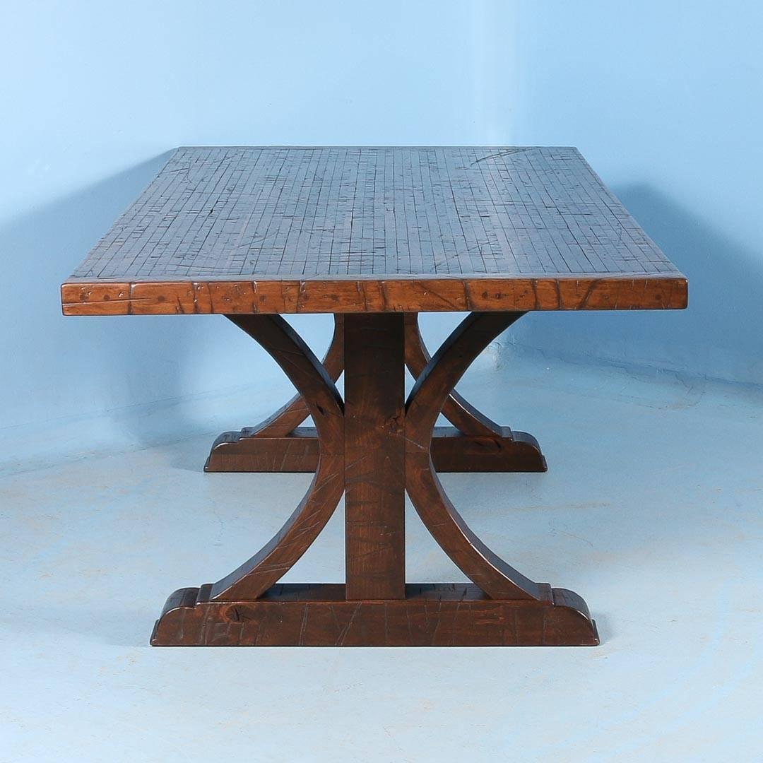 This 8′ long dining table was custom-made using reclaimed maple boxcar flooring. The distressed wood is a result of years of moving cargo through the train’s boxcars – it has been sanded, stained and given a strong finish for daily use. The base is