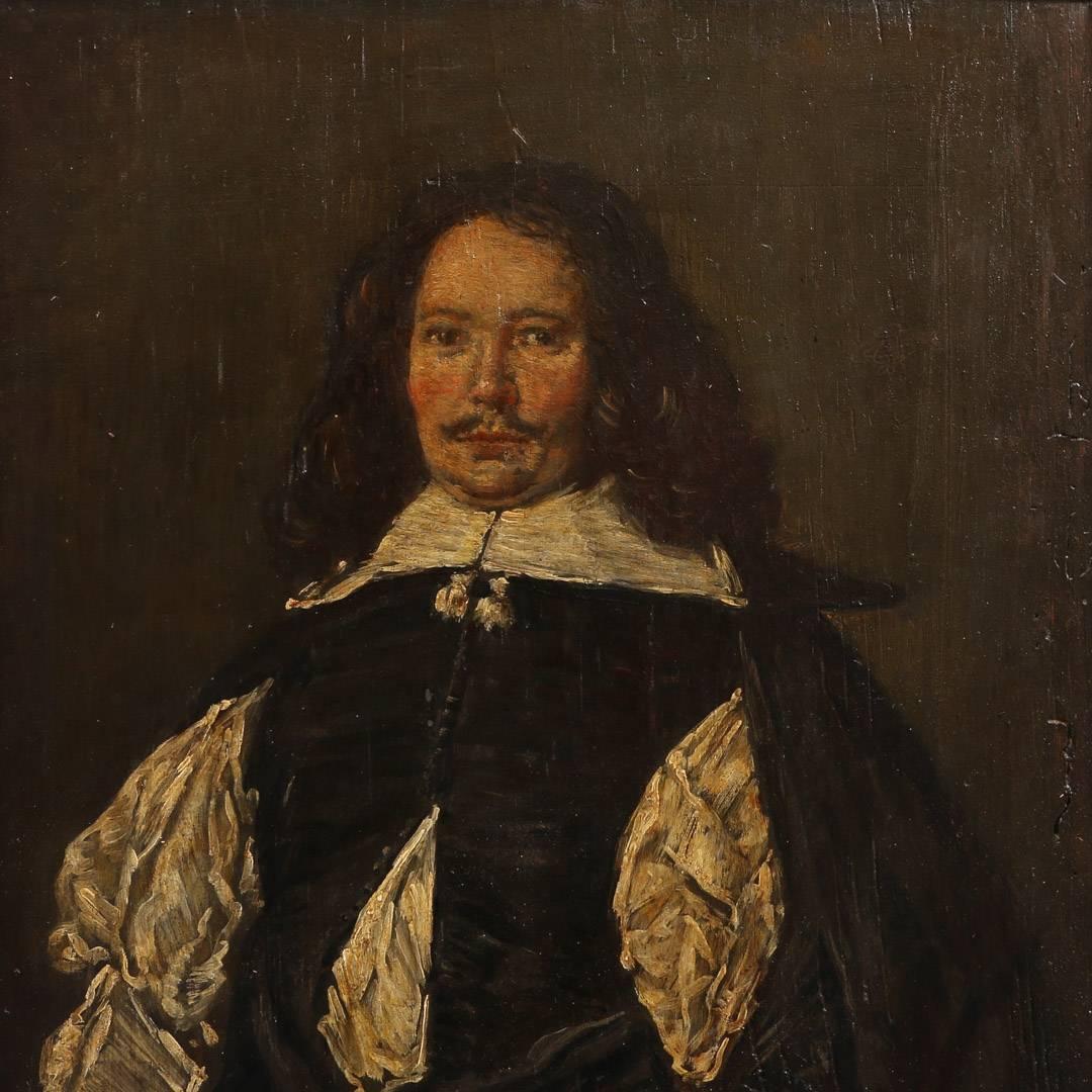 Unsigned antique Dutch painting of a gentleman of the 17th century, painted on a pine panel, circa 1840. This is a 19th century copy of Frans Hal’s ‘Portrait of a Gentleman’. The panel is mounted in an antique black and parcel giltwood frame which