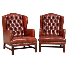 Coppia di poltrone club Chesterfield danesi del XX secolo in pelle color sangue di bue con schienale ad ali