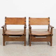 Pair of Mid-Century Spanish Brutalist Cognac Leather Arm Chairs