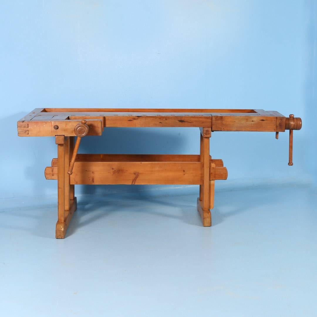 Beautiful antique Hungarian carpenters’ workbench, bearing a warm patina after years of traditional use. Please examine the close up photos to appreciate the depth of the patina. It has two vices with wood handles and a recessed tray where the