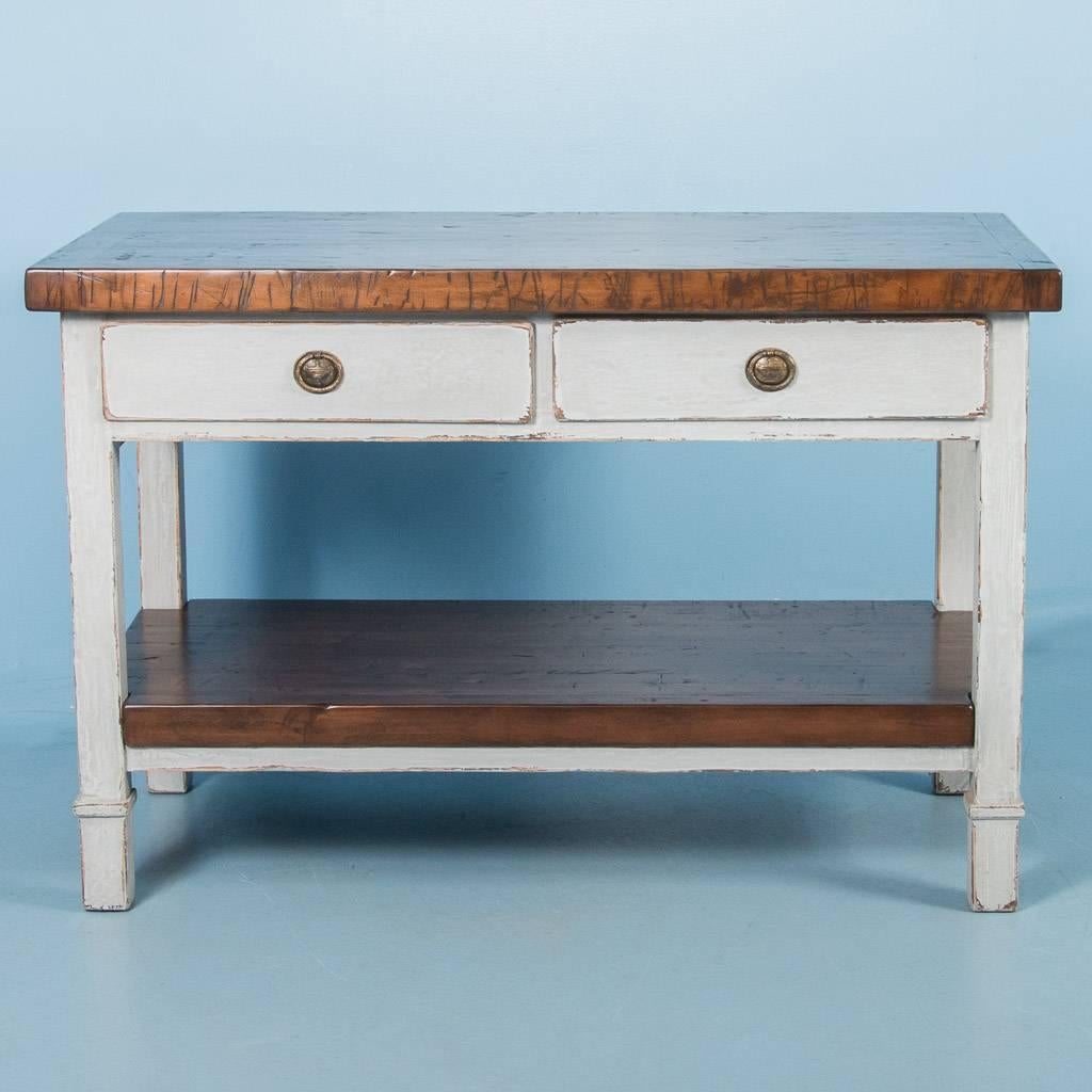 Custom kitchen island with a maple top and bottom shelf made from reclaimed boxcar flooring. The 19th century farm table is painted a distressed light grey, adding a nice contrast to the darker maple top. Notice in the close up photos, the deep,