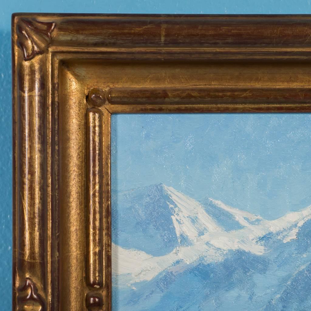 Original oil painting of snow capped mountains in the San Juans of Southern Colorado. Signed matte Smith in the lower left, this winter landscape painted on linen and mounted on board, comes with a giltwood frame and is titled “San Juan Winter.”