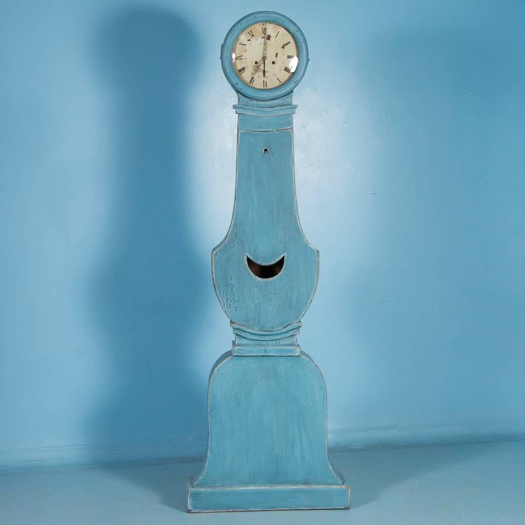 Antique Swedish Mora grandfather clock, circa 1800-1840 with (new) distressed blue paint. Graceful curves and simplistic lines accentuate the country beauty of this antique grandfather clock from Sweden. Please examine the close up photos to