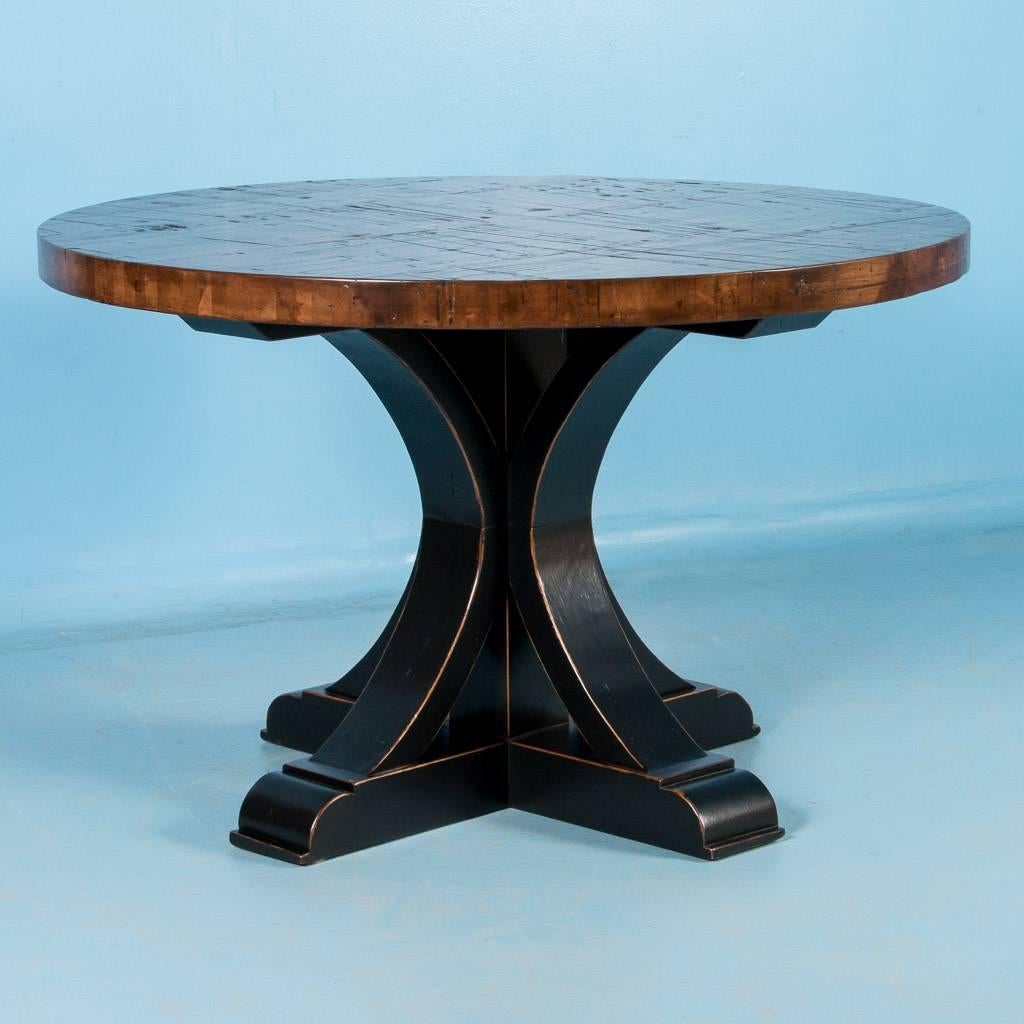 This 48″ diameter table was custom-made using reclaimed maple boxcar flooring. The distressed wood is a result of years of moving cargo through the train’s boxcars – it has been sanded, stained and given a hard finish for daily use. The base is made