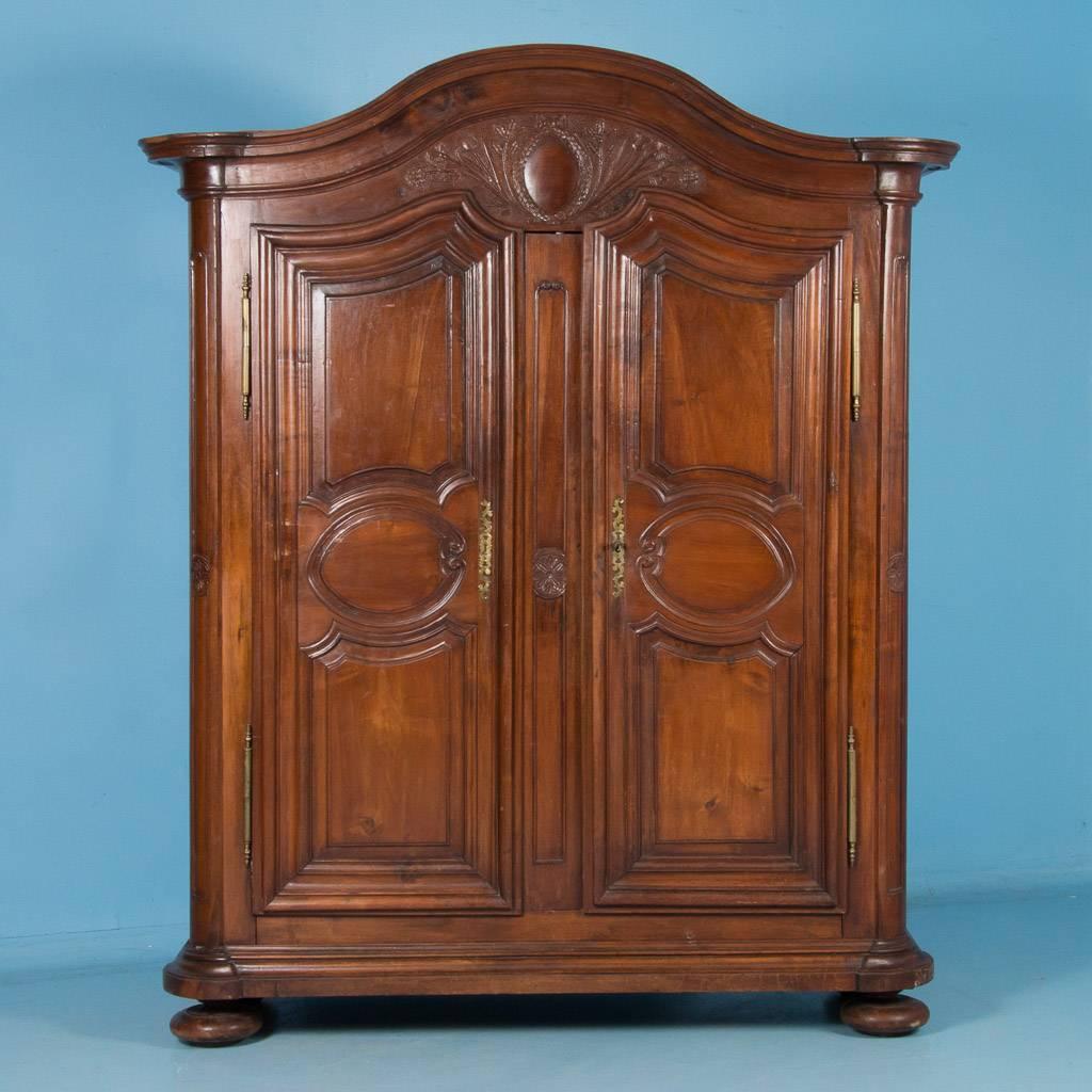 There is something enchanting and unique to antique French armoires, and it stems from the beauty of the aged wood, which grows richer and deeper by the passing of the years. This traditional French provincial armoire was made of walnut sometime in