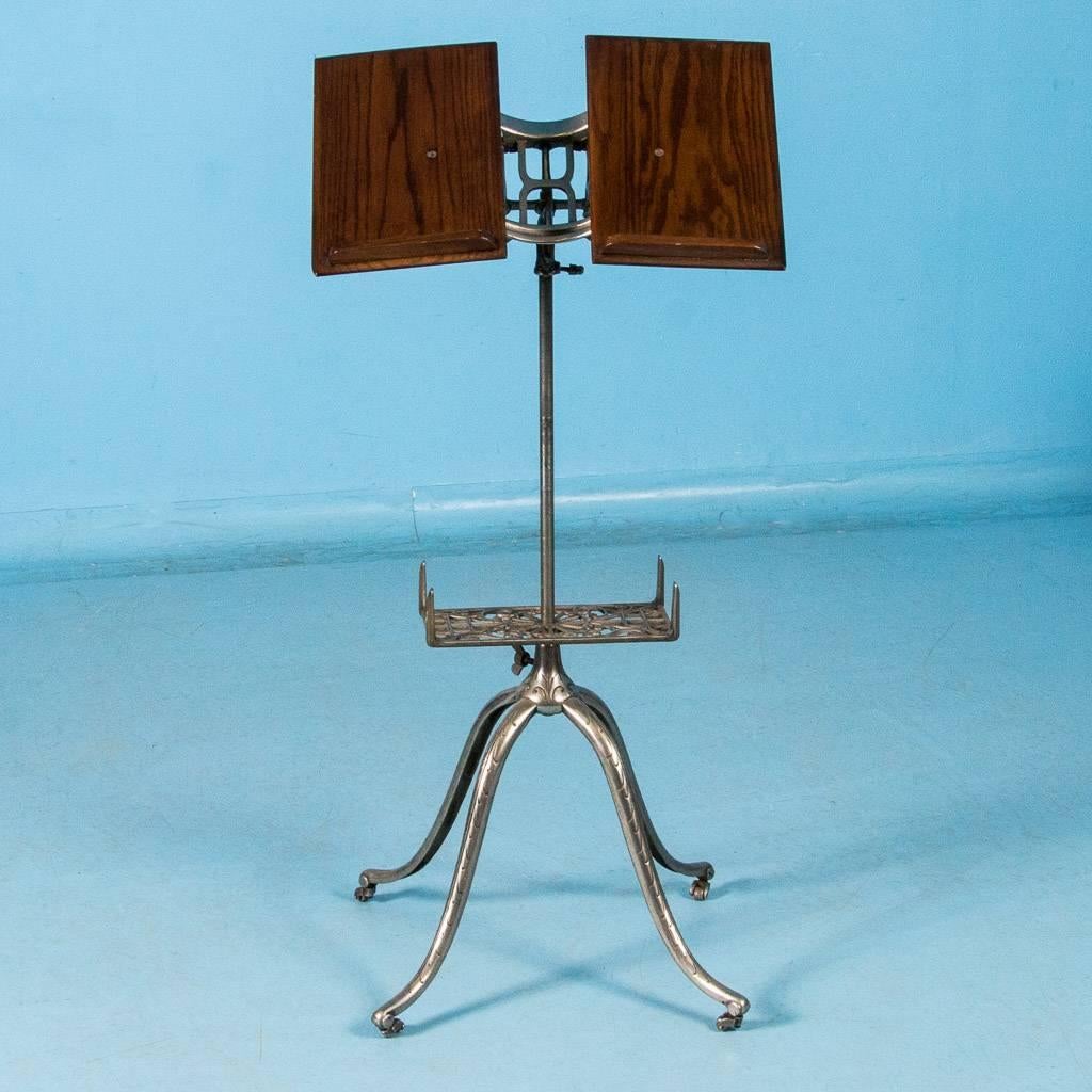 Antique American adjustable dictionary stand, circa 1890-1910. Made for very large and heavy dictionaries or Bibles, the oak book supports can be adjusted outward for wider books and inward for smaller ones. Also, the supports can be tilted from