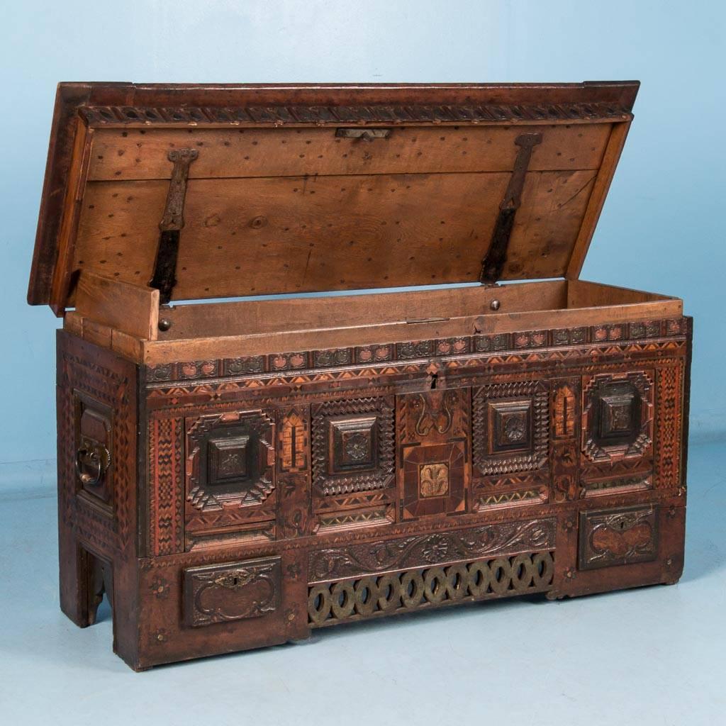 This unusual antique Danish Baroque trunk dates to the late 18th century, circa 1760-1800. Made of oak with original hardware, carved moldings and exotic wood marquetry, the quality and craftsmanship are exceptional. Take note of the two small