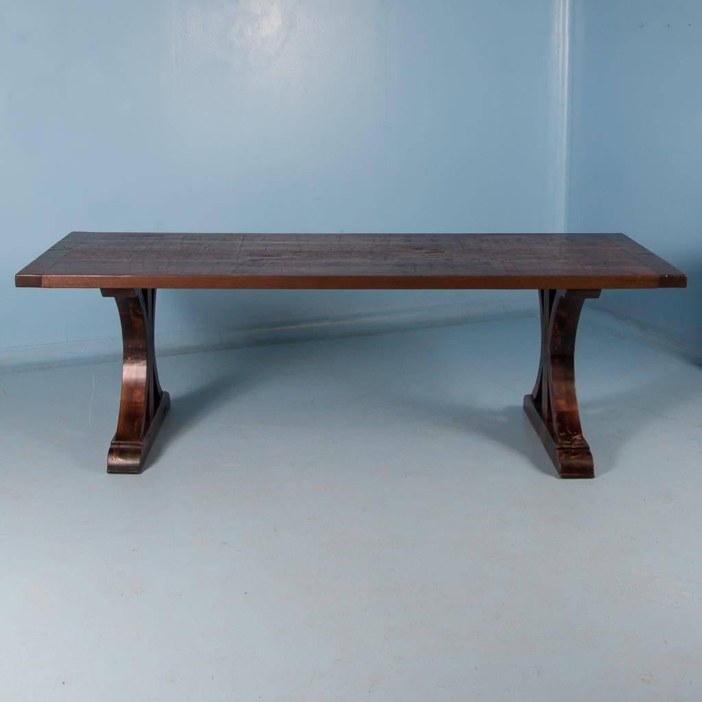 This 8′ long dining table was custom-made using old reclaimed mahogany boxcar flooring. The distressed wood is a result of years of moving cargo through the train’s boxcars. It has been sanded, stained and given a durable finish for daily use. The
