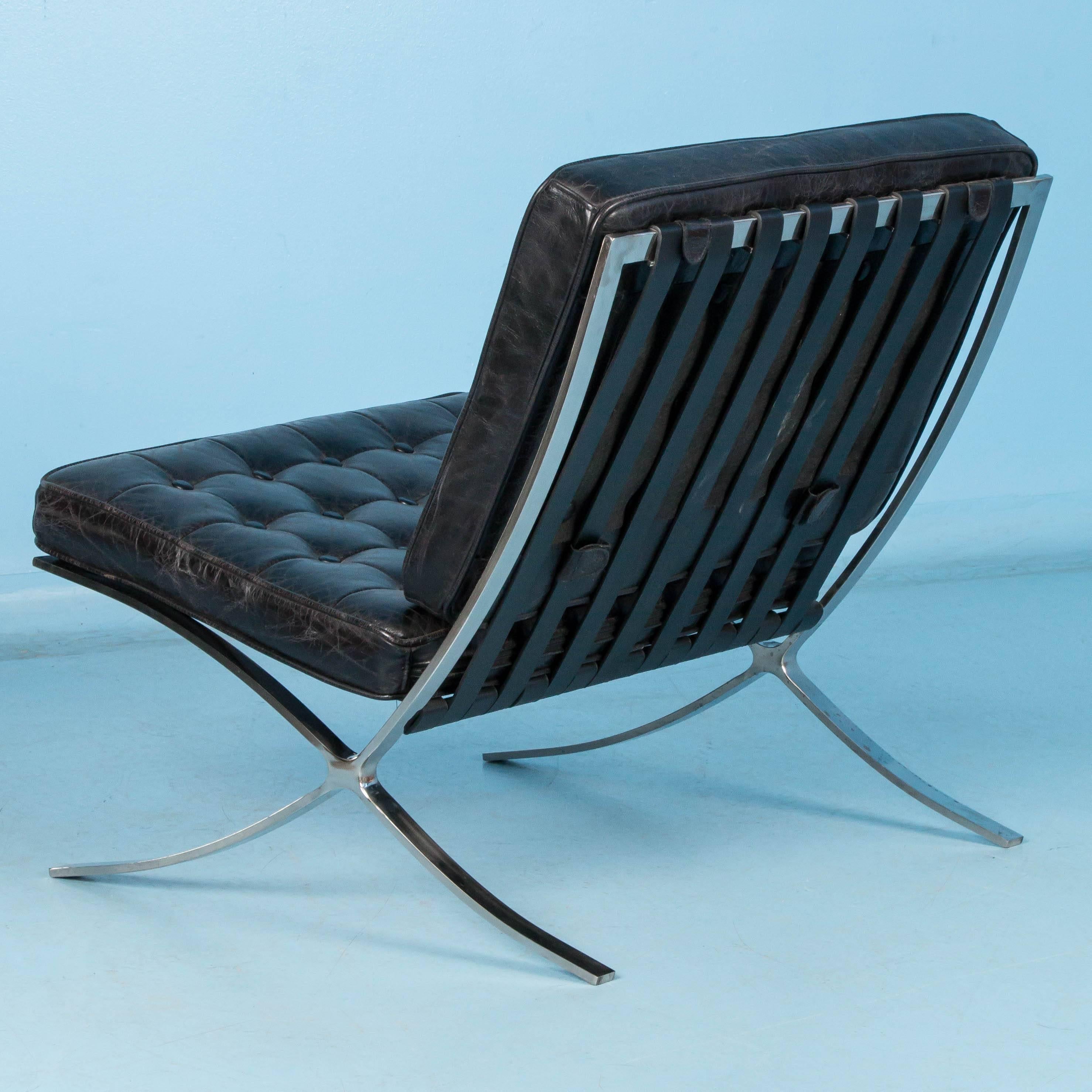 This new Barcelona style black leather chair has a vintage Mid-Century look featuring a chrome frame and tufted leather seat and back. The chair sits well with its generous width and is very comfortable. There are two chairs available as well as a