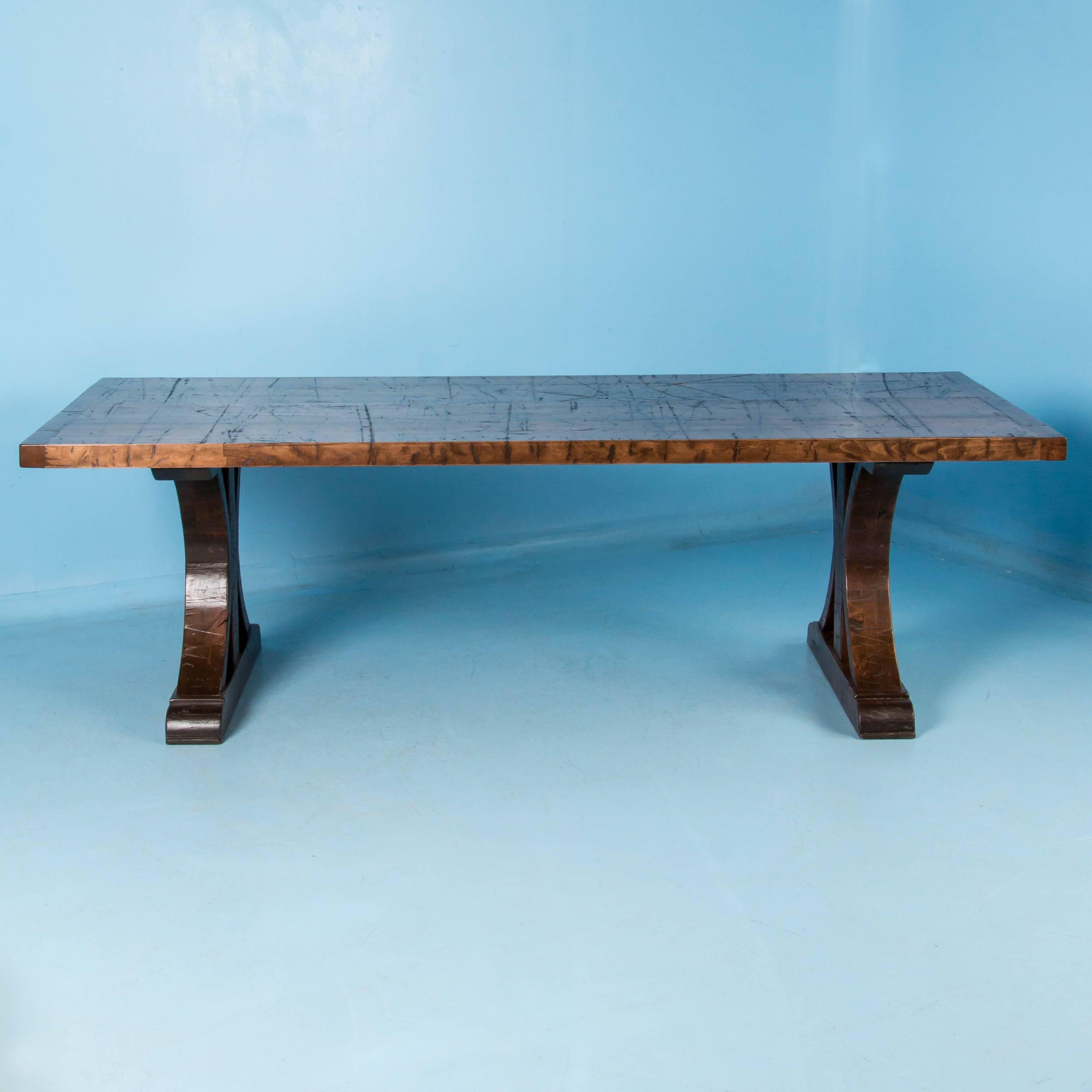 This 8' long dining table was custom-made using antique reclaimed maple boxcar flooring. The distressed wood is a result of years of moving cargo through the train’s boxcars, it has been sanded, stained and given a strong finish for daily use. The