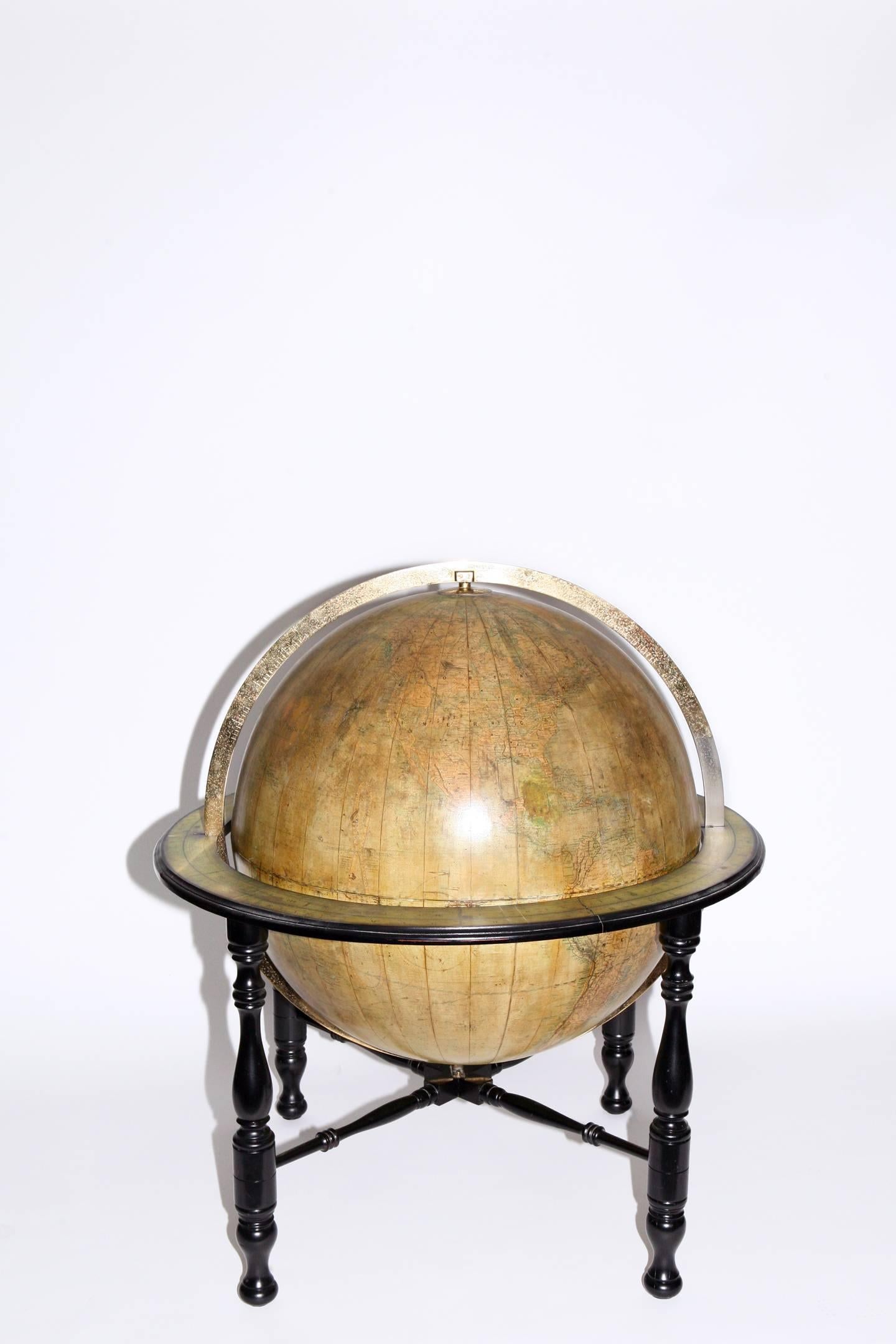 30 inch diameter library globe featuring Oklahoma with Indian territory, circa 1890. Maker is Johnston, Edinburgh, Scotland, a renowned British globe producer. Mounted on ebonised turned leg Stand with cross stretchers featuring brass meridian and