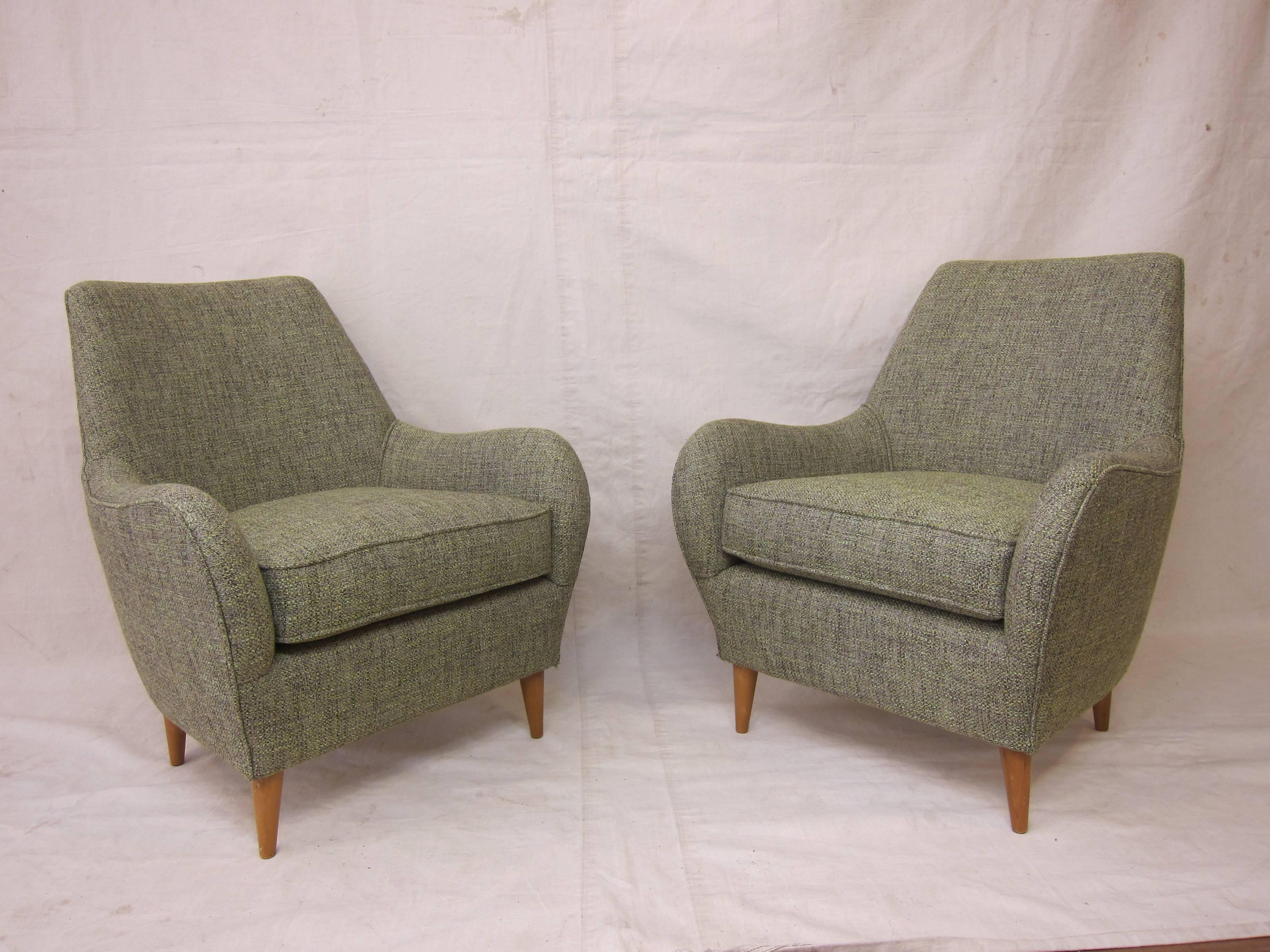 Exceptional 1950's sculpted Italian Club Chairs.  Very comfortable, great size having a smaller foot print, newly upholstered.   