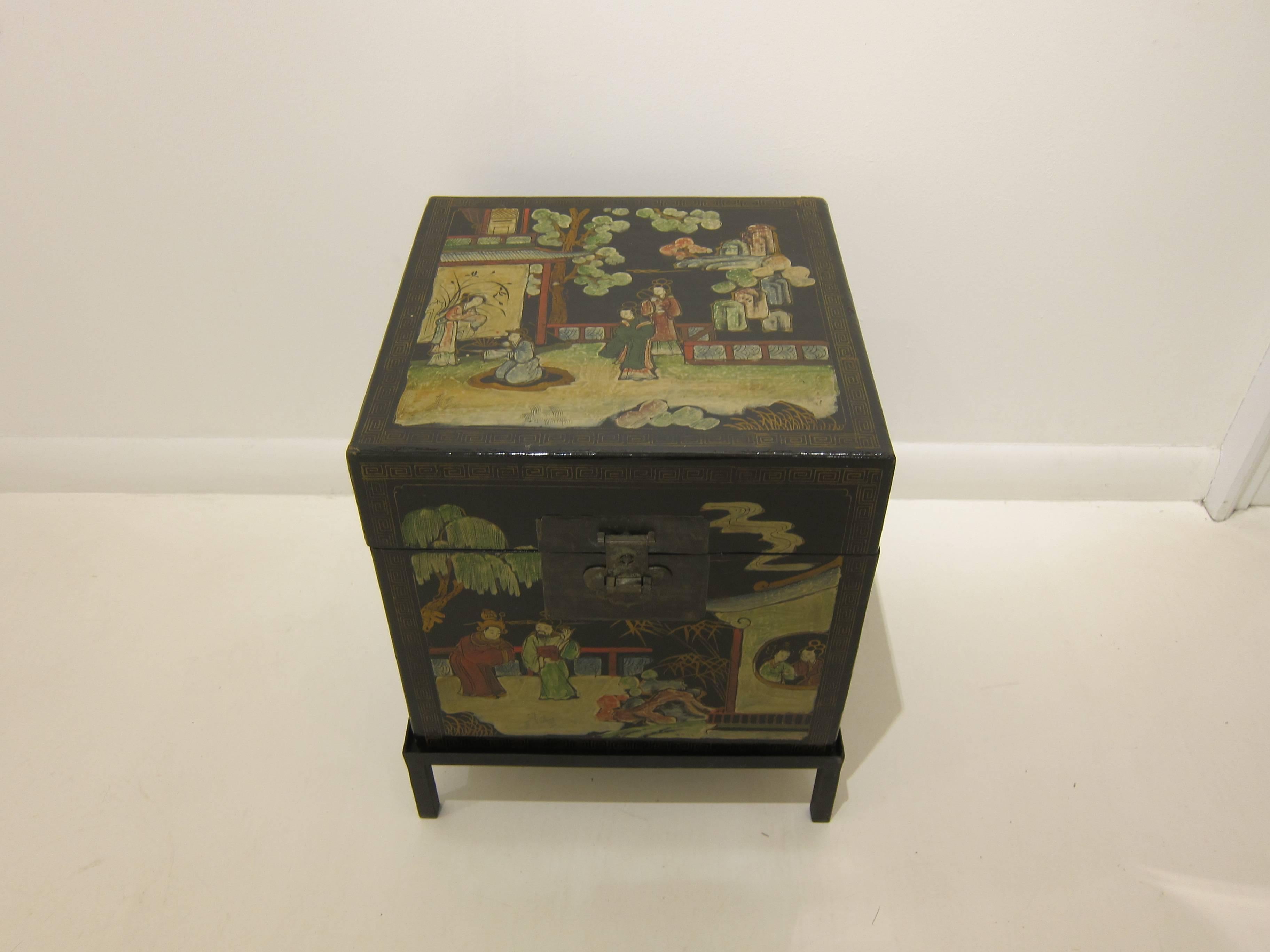 A 19th century painted chinoiserie travel box on iron stand. Excellent side table with storage. Wrapped leather over wood with wonderful painted scenes. Beautiful interior color with good storage capability. China, circa 1890-1900
Very good