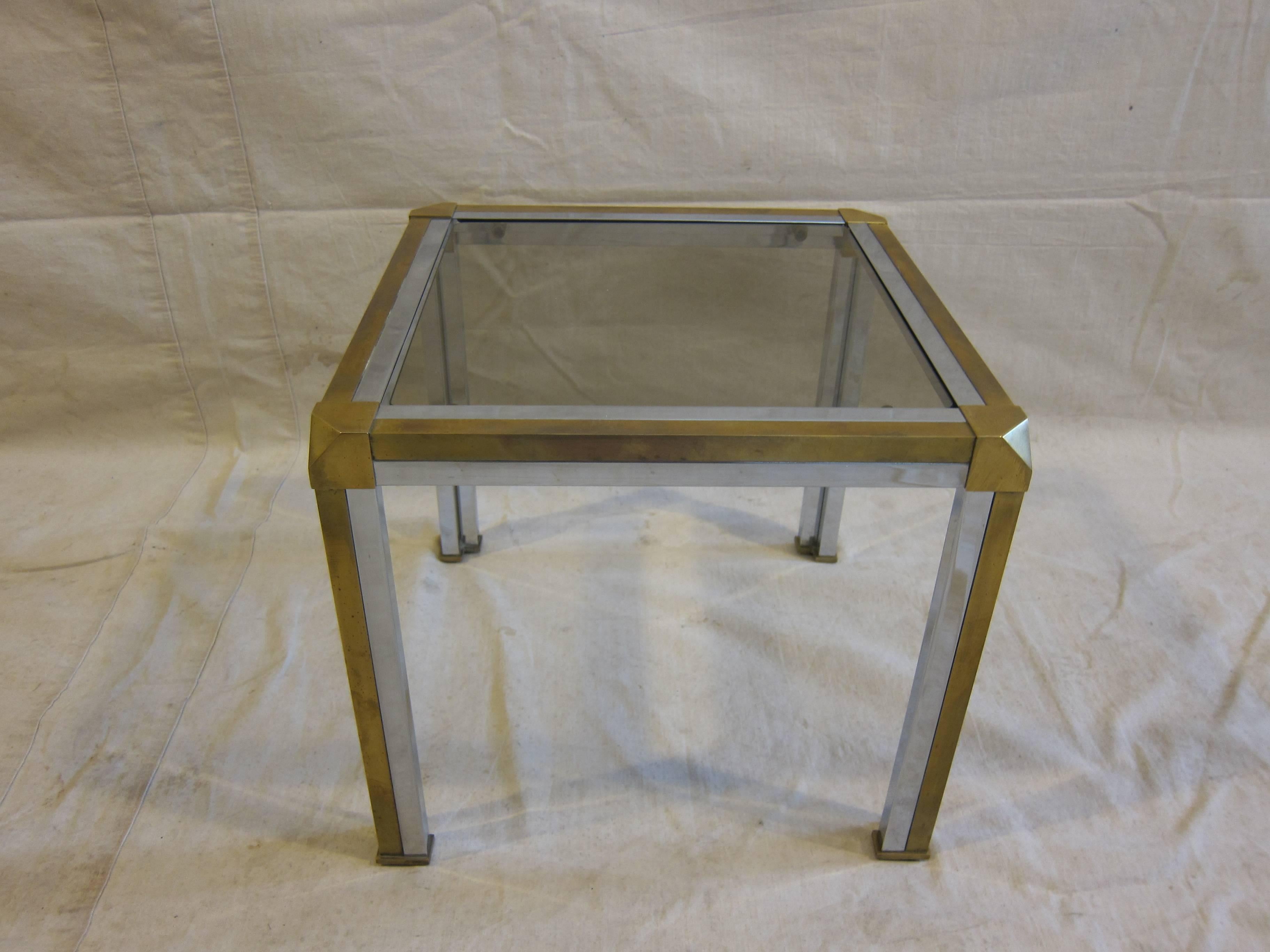 Midcentury Italian Brass and Chrome side table tinted glass attributed Romeo Rega.  Angled legs with turned down corners. In very good condition, brass has aged patina.  Heavy table with solid weight.  Great period piece.  