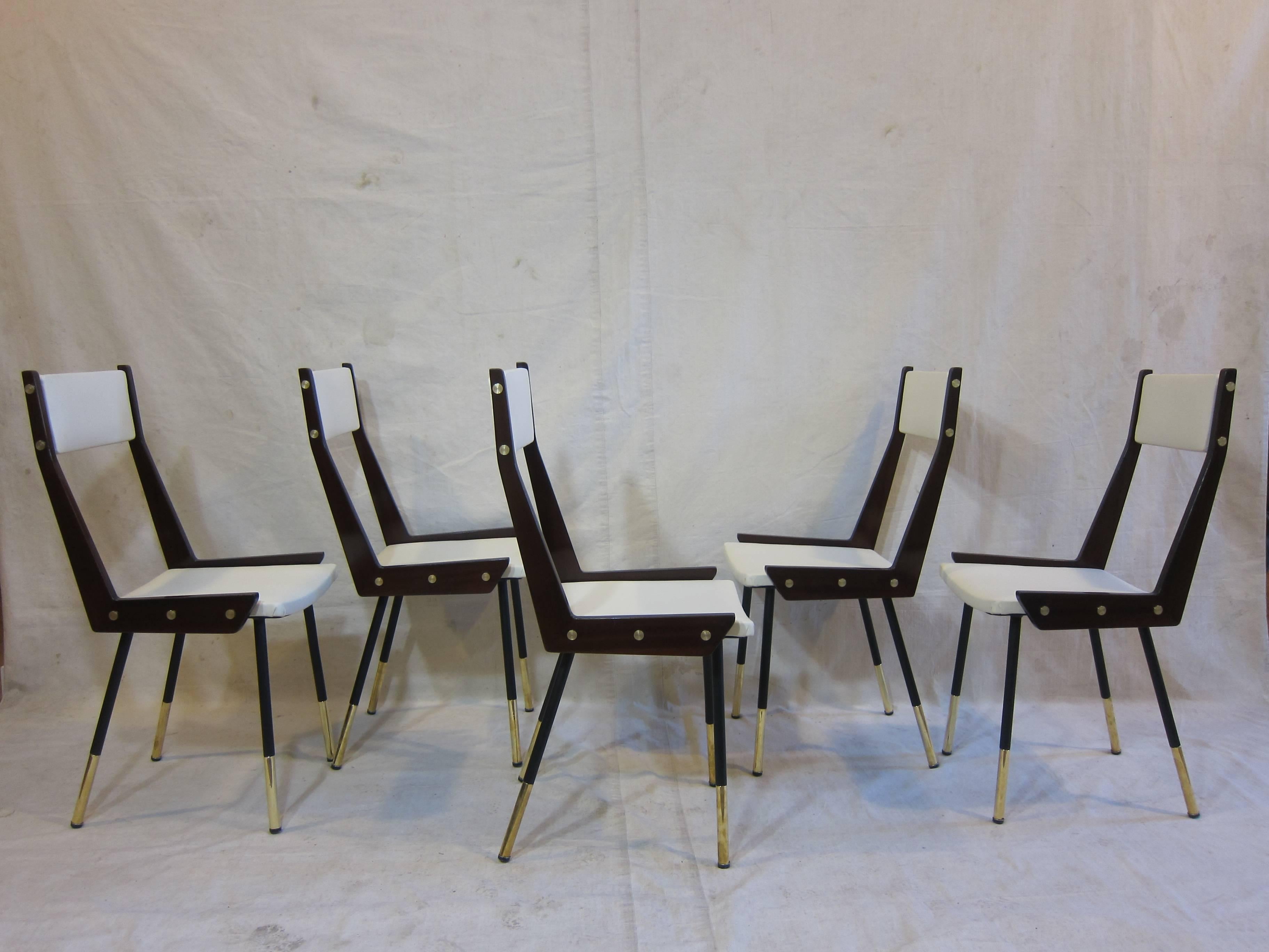 A rare set of Gianfranco Frattini chairs. Elegantly detailed with brass details, sabots, buttons, spacers and nail heads. Meticulously restored in excellent condition.  We have Five chairs, sale options set of 4,  and 1 that can be sold separately