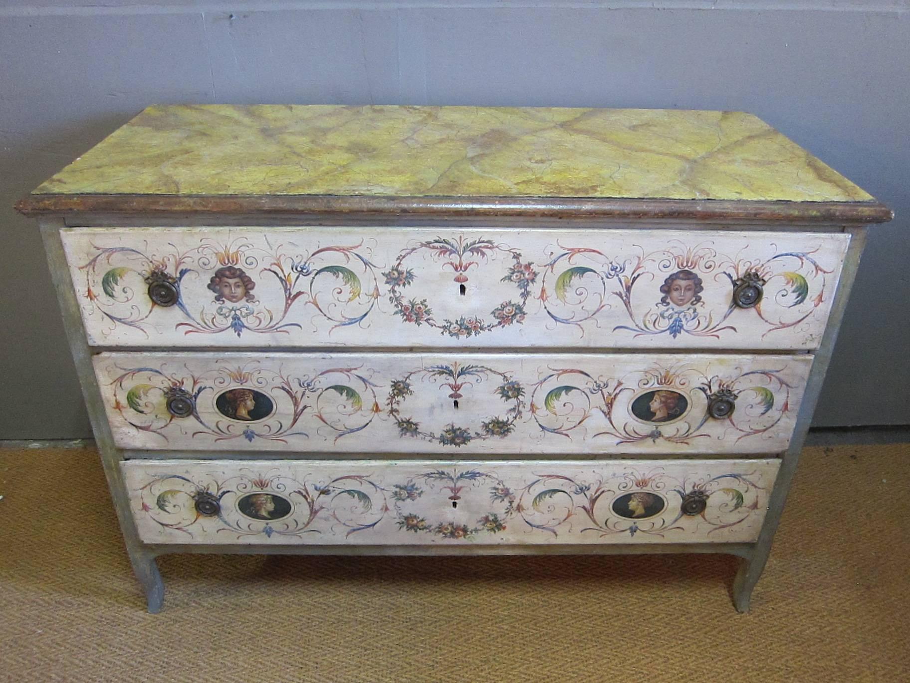 Early 19th century Italian painted commode chest of drawers. Large-scale with excellent color, faux marble painted top. Frame color is faded blue to green with many colors found throughout the paint work. Over time some paint work has been
