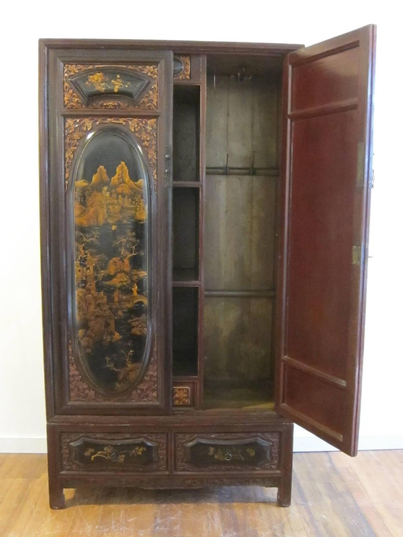 19th century gilt painted wardrobe cabinet. A very special Qing dynasty wedding cabinet elaborately decorated with fine and exceptional gilt painting. The lacquer can be referred to as having a snake like skin or (alligator-ing) this happens through