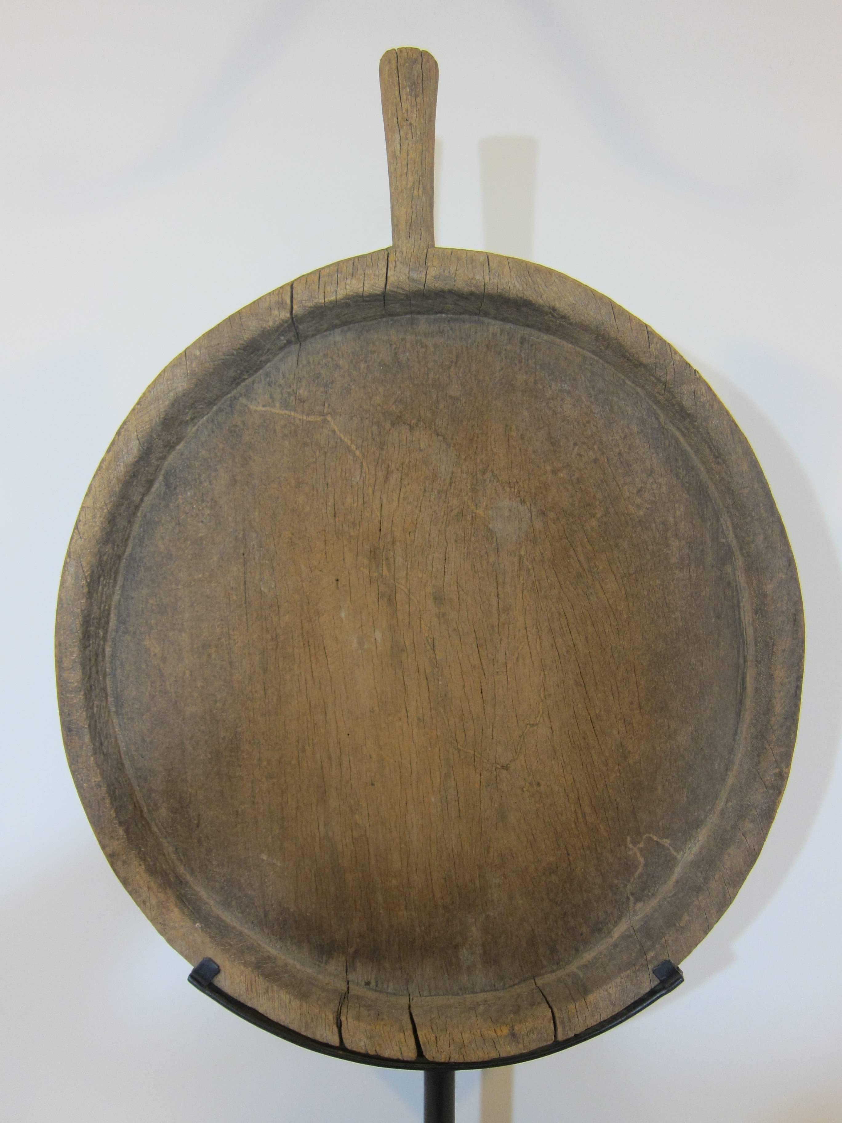 19th century hard wood grain sifter on stand. A monumental solid wood utilitarian hand-carved grain sifter. Used to sift grains and rice for food preparation, circa 1800 or earlier. The wood stand is 18 inches long 5 inches deep. Item stands 46.5