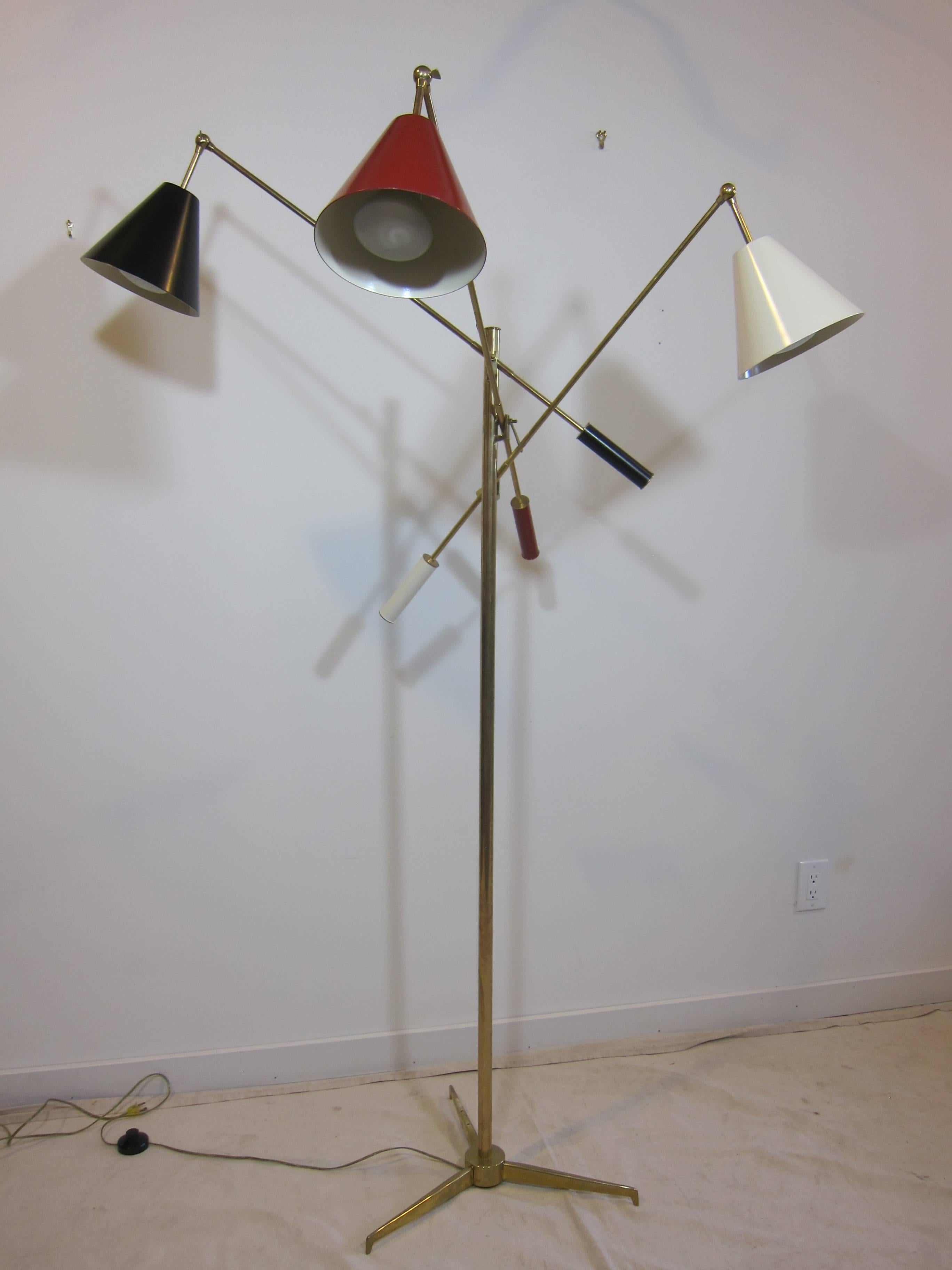 Arredoluce Triennale brass floor lamp. Shades are in black, red, and white with brass rods to counterbalance handles. On off switch on the cord. Marked AL. Designed by Angelo Lelli for Arredoluce, Monza. New wiring. Very good condition.