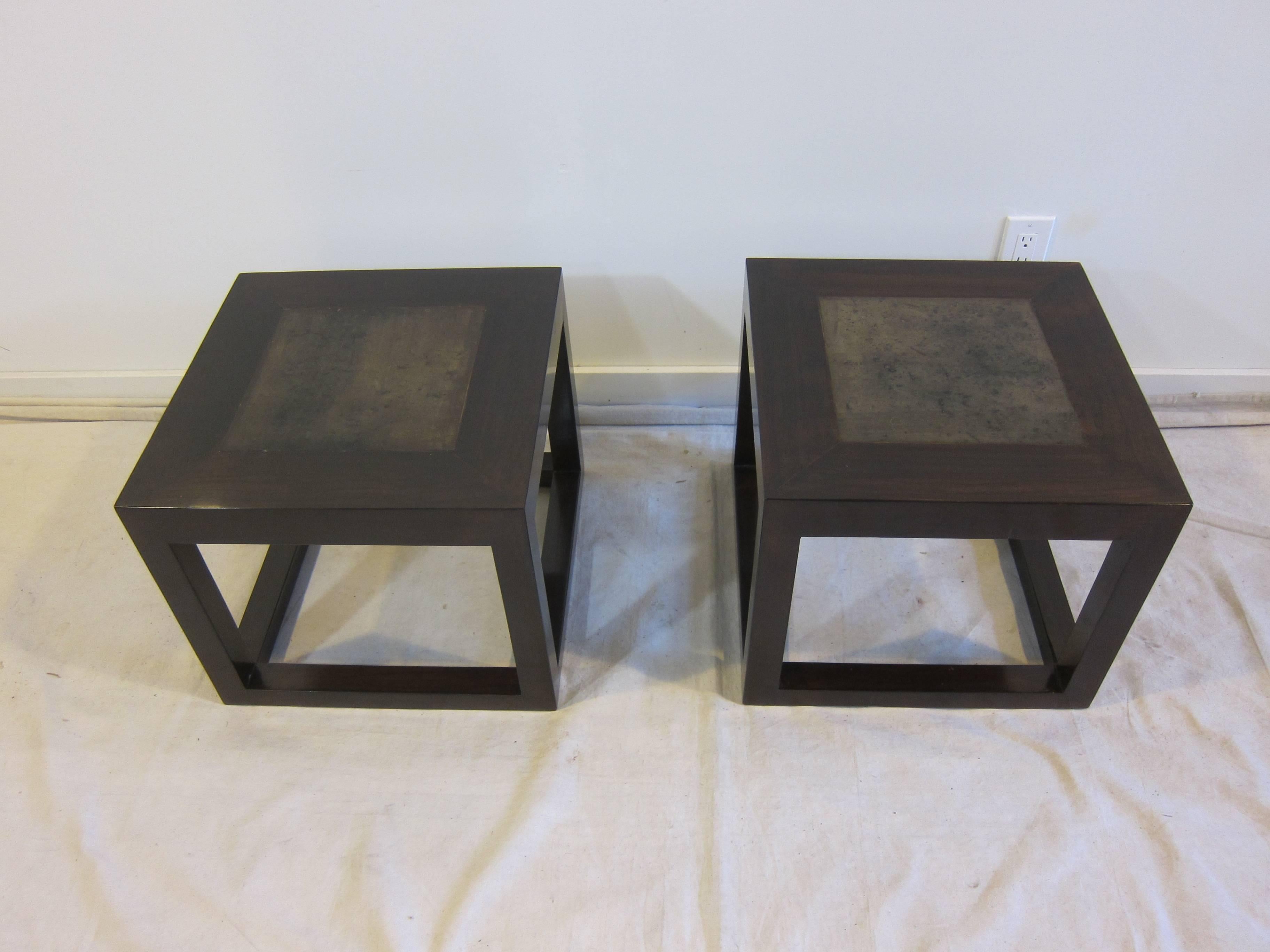 A pair of elmwood cube tables with inset stone tops. Very good condition, one top has a small indentation pictured. Color dark brown to walnut.
Can be used together as one table or as individual side tables.  Square side tables, end tables with