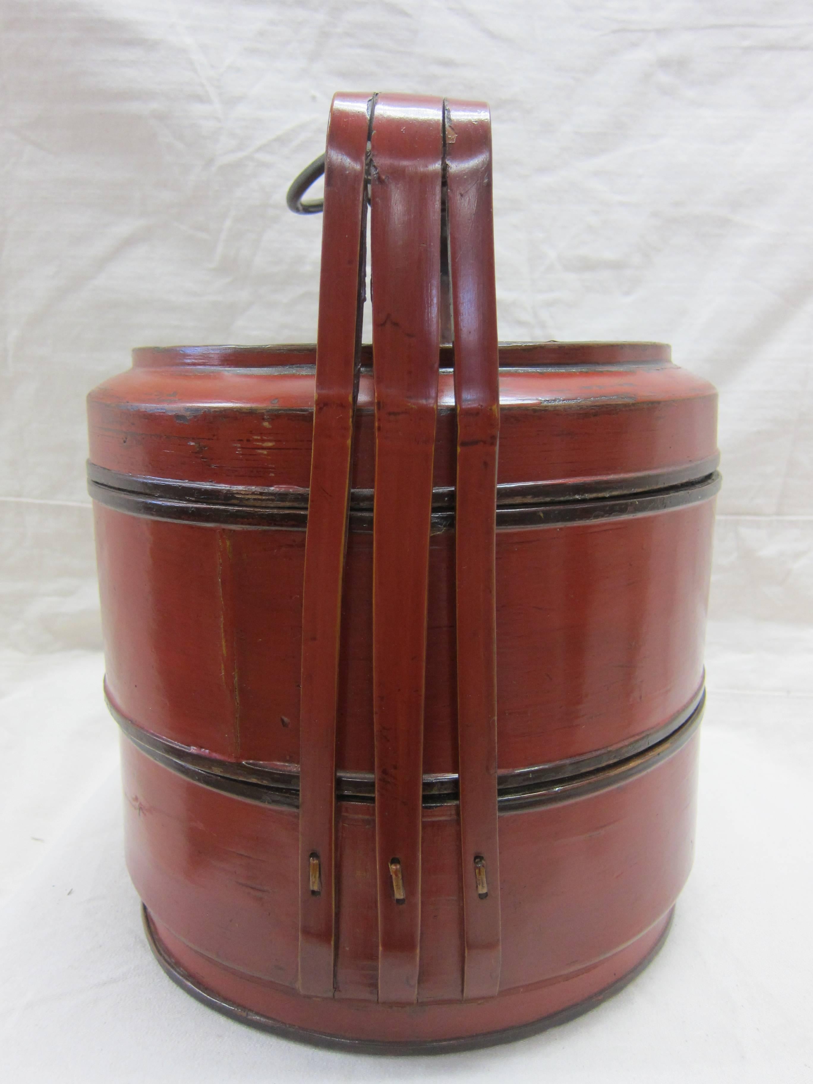 Antique basket box food caddy. Made from cypress wood and turned bamboo with red lacquer exterior. Very nice food caddy originally used for storing, transporting and serving food.
Very good condition.