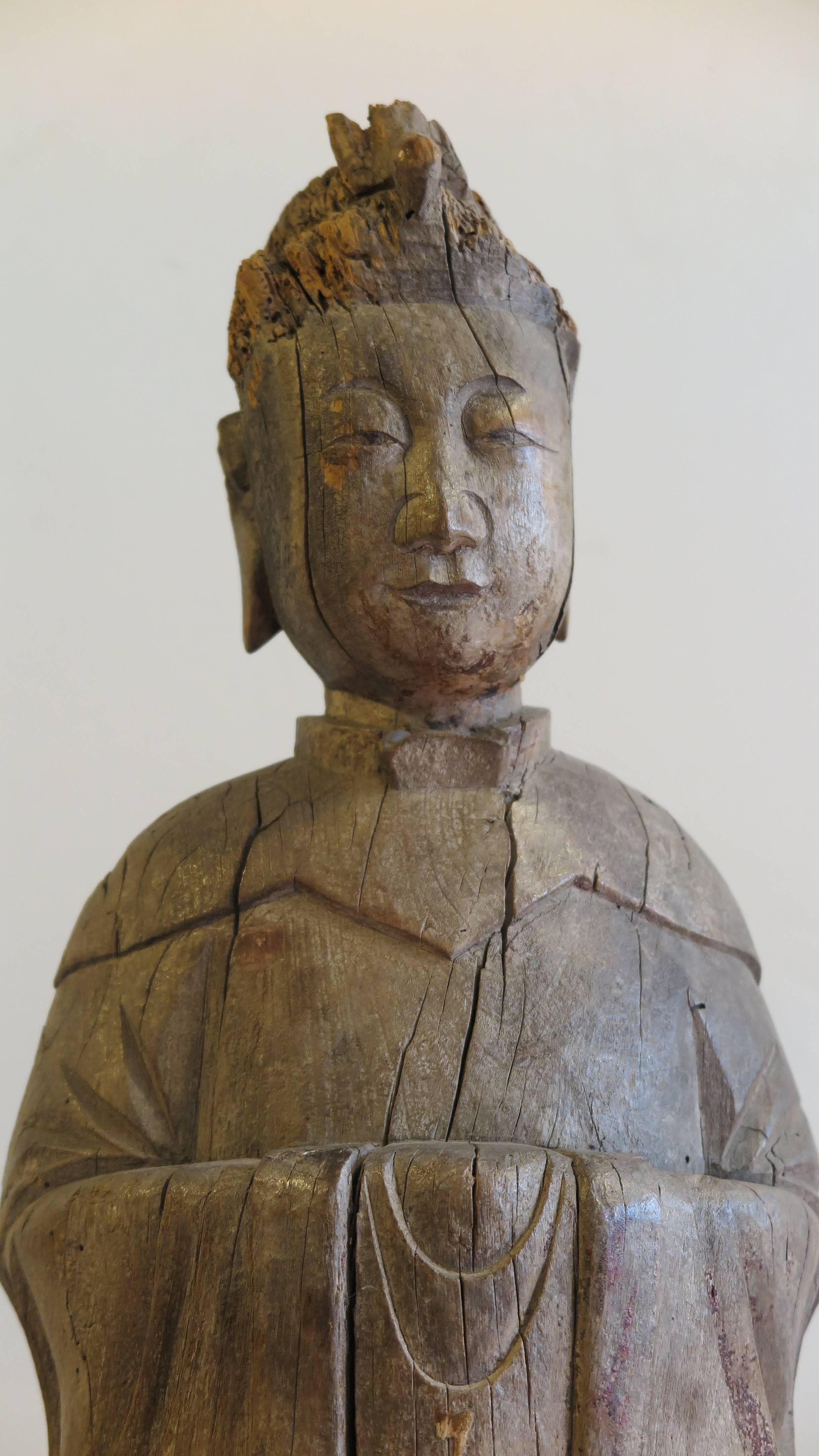 19th century Buddhist statue sculpture. A rare representation with a dove resting on head or as headdress. A majestic serene sculpture with significant presence and beauty. A solid one piece wood block carving, Hunan Province, Southern China, circa