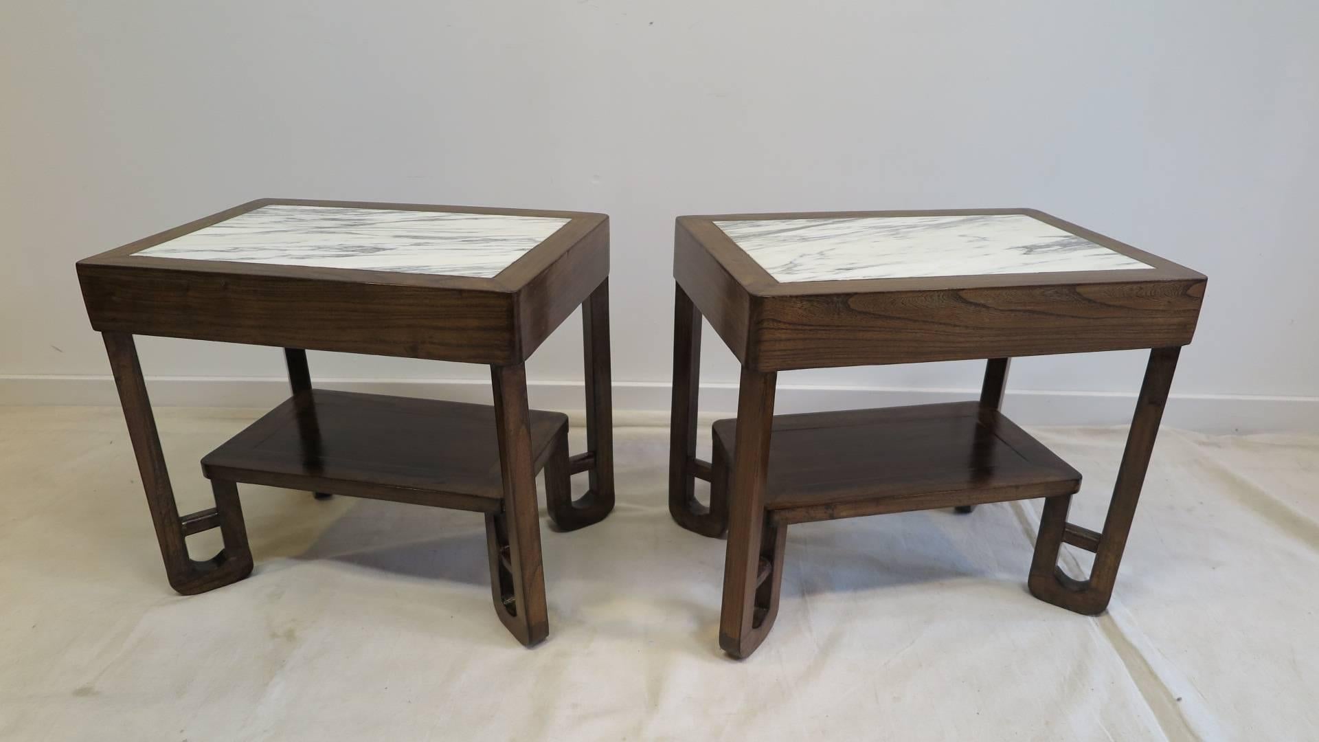 Art Deco side table with marble inlay top and a lower shelf.   Art Deco side table made of Elm wood with Carrara marble set into the top showcasing both natural elements, Marble and the wood.  Radius corners terminating into architectural turned