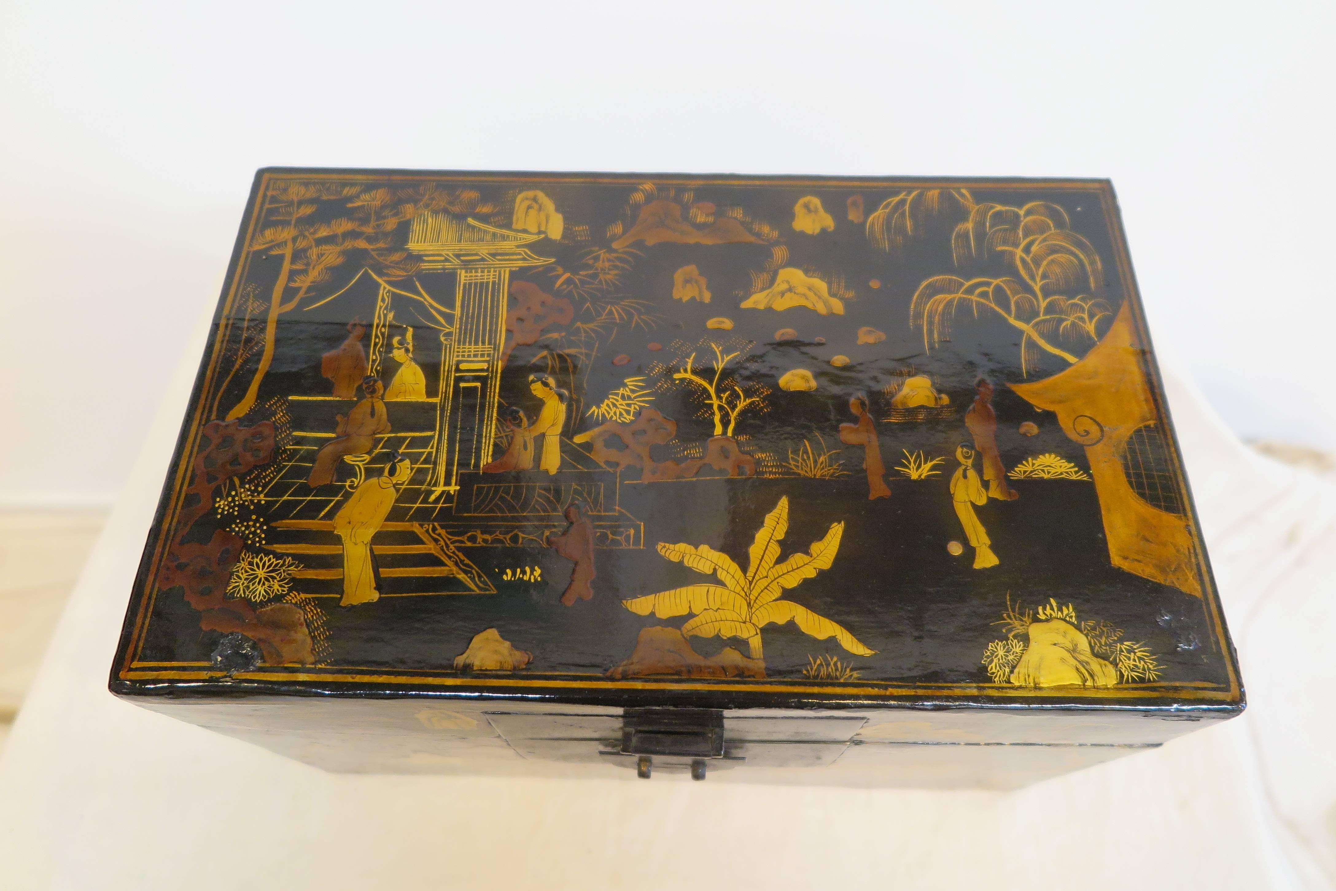 A Chinoiserie decorated lacquered Box. Having gilt painted lacquered exterior with remnants of a painted lacquered interior.  As a heirloom box, over time, these types of boxes were repaired and re-polished to maintain the lacquering usually on the