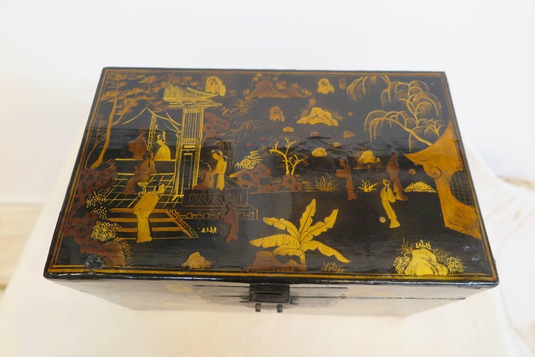 A Chinoiserie decorated lacquered Box. Having gilt painted lacquered exterior with remnants of a painted lacquered interior.  As a heirloom box, over time, these types of boxes were repaired and re-polished to maintain the lacquering usually on the