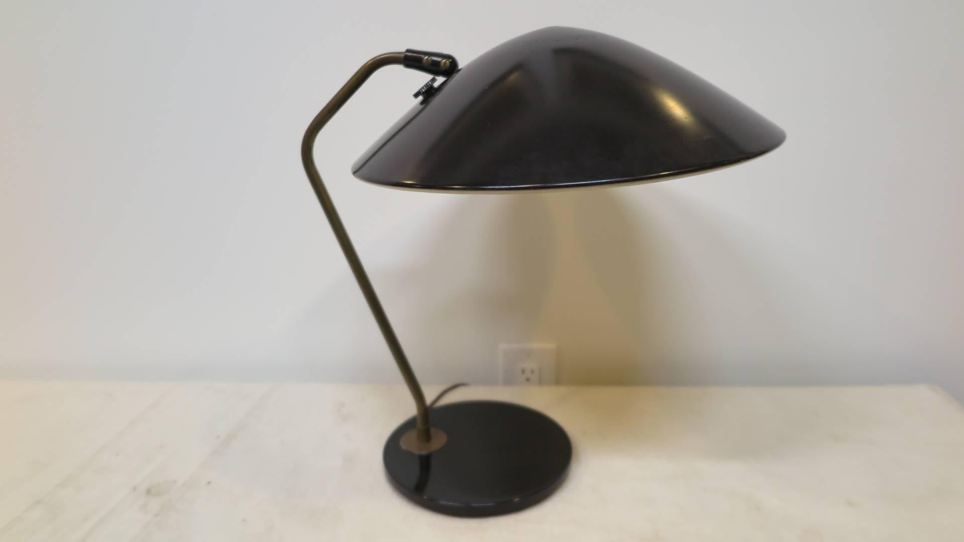 Gerald Thurston for lightolier desk table lamp with articulating shade. This lamp has a three way switch. In good original condition.