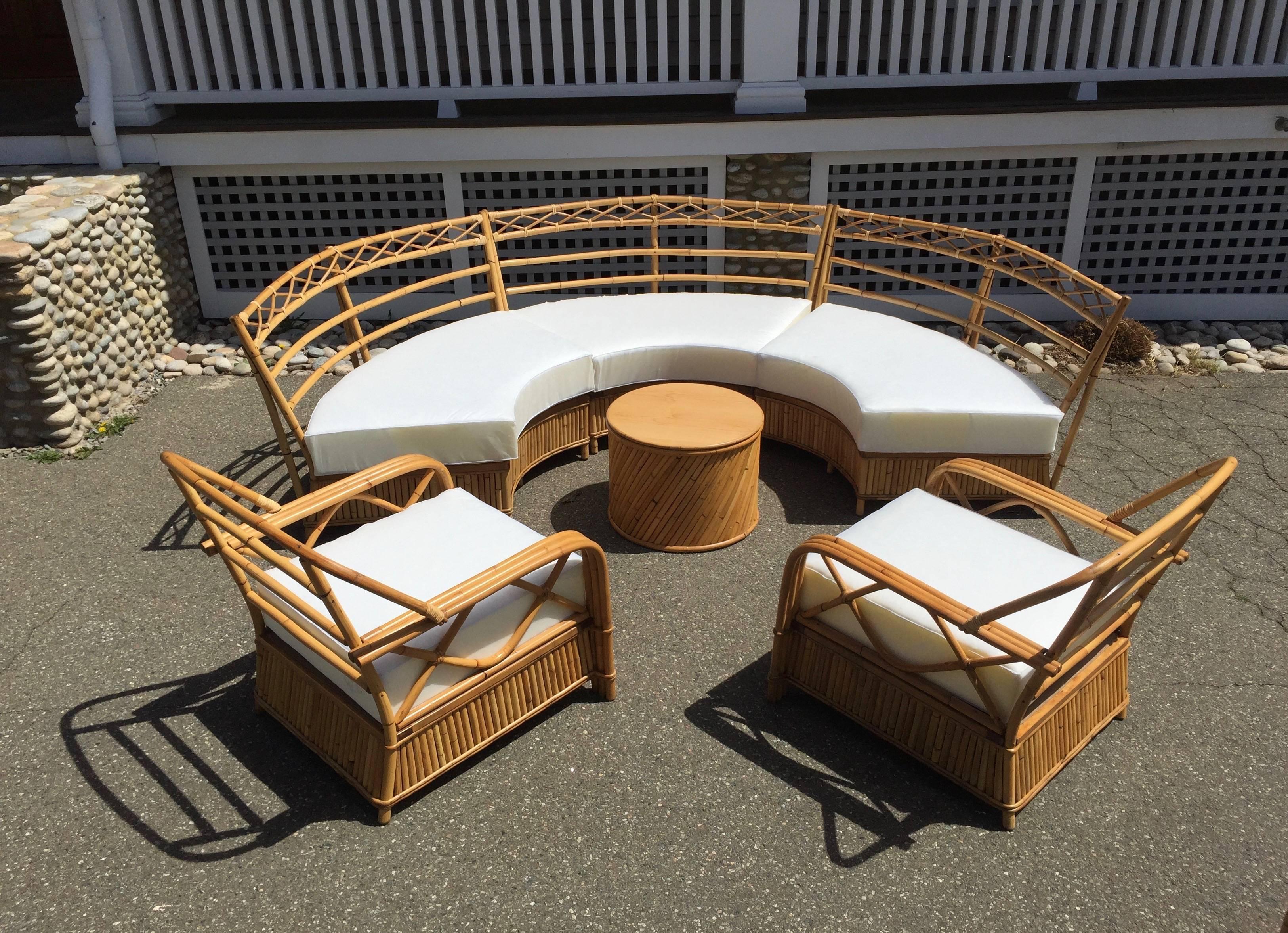Rare ficks reed sectional sofa and matching lounge chairs. A complete set with coffee table and ottoman. Matching step tables also available.
Sectional measures 112