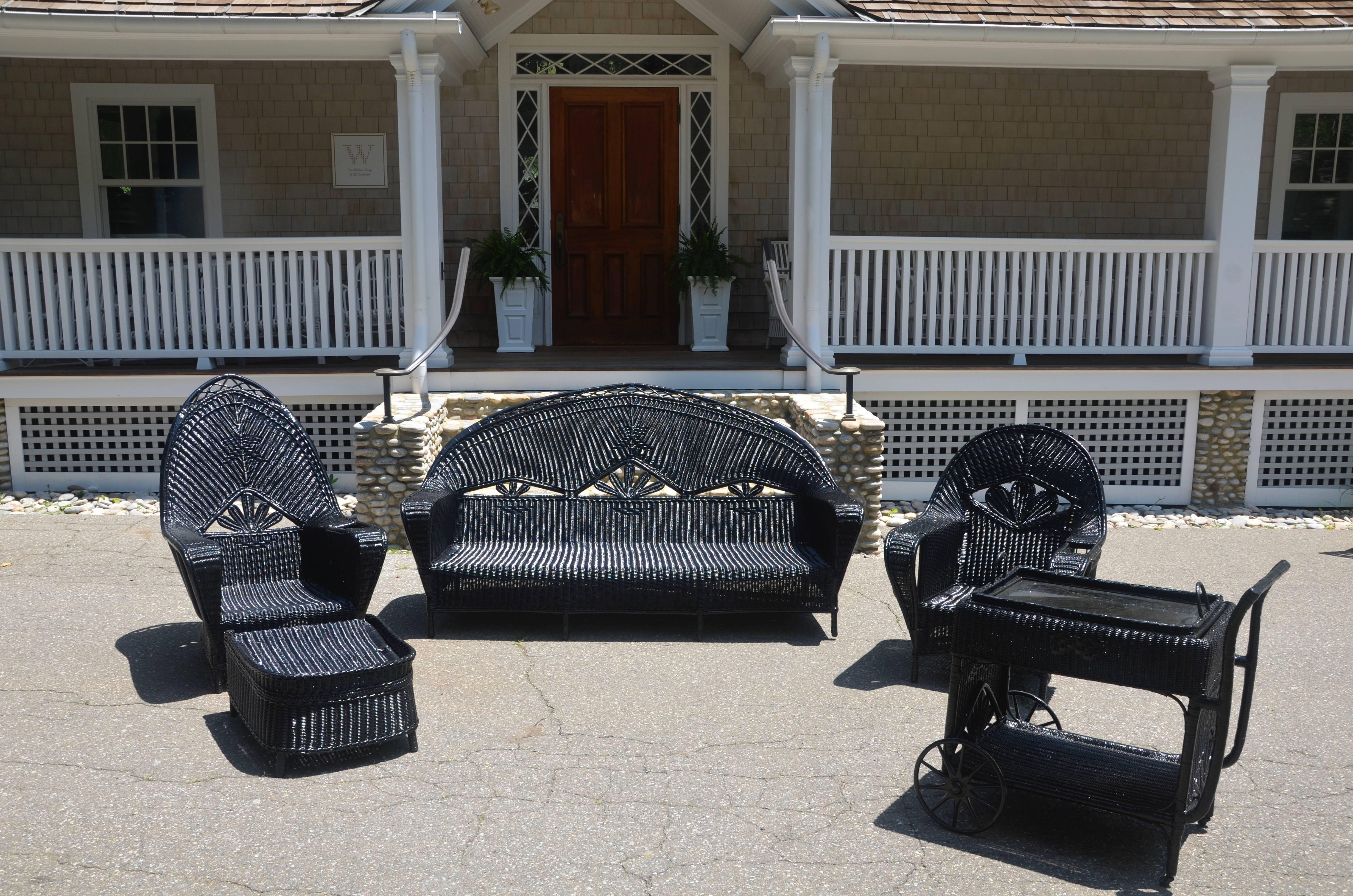 Antique wicker set woven of reed and painted black including an ottoman and teacart. Large-scale and sturdy set in hard to find design.
Measures: Sofa 42