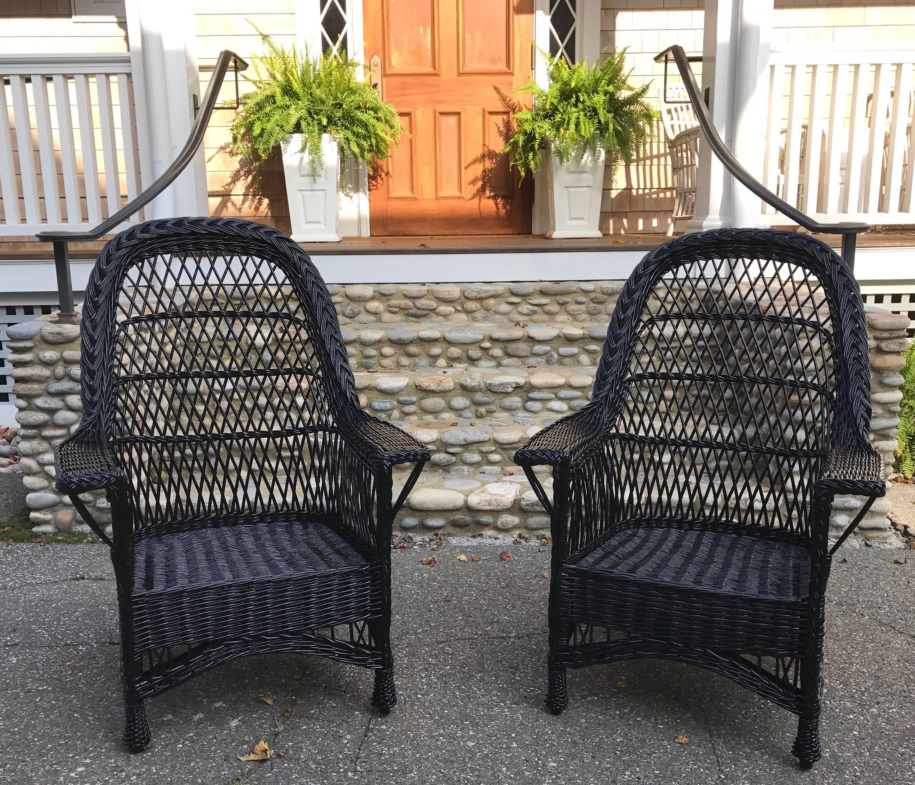 Beautiful antique Bar Harbor wicker chairs woven of willow and freshly painted black.