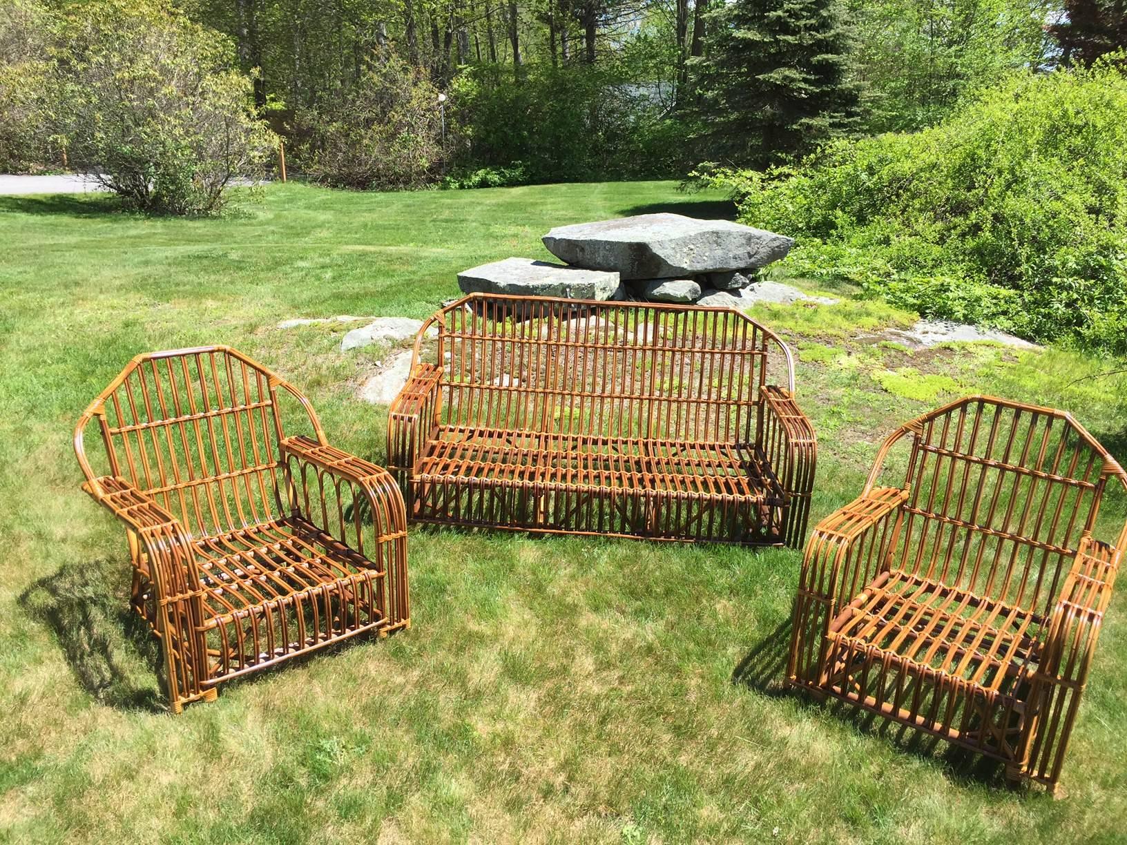 Antique stick wicker set in restored natural finish. Beautiful variations in color on the unpeeled rattan material. Deep seated and sturdy this set measures 32" wide, 32"deep and 34" tall for each chair. The sofa measures 70"